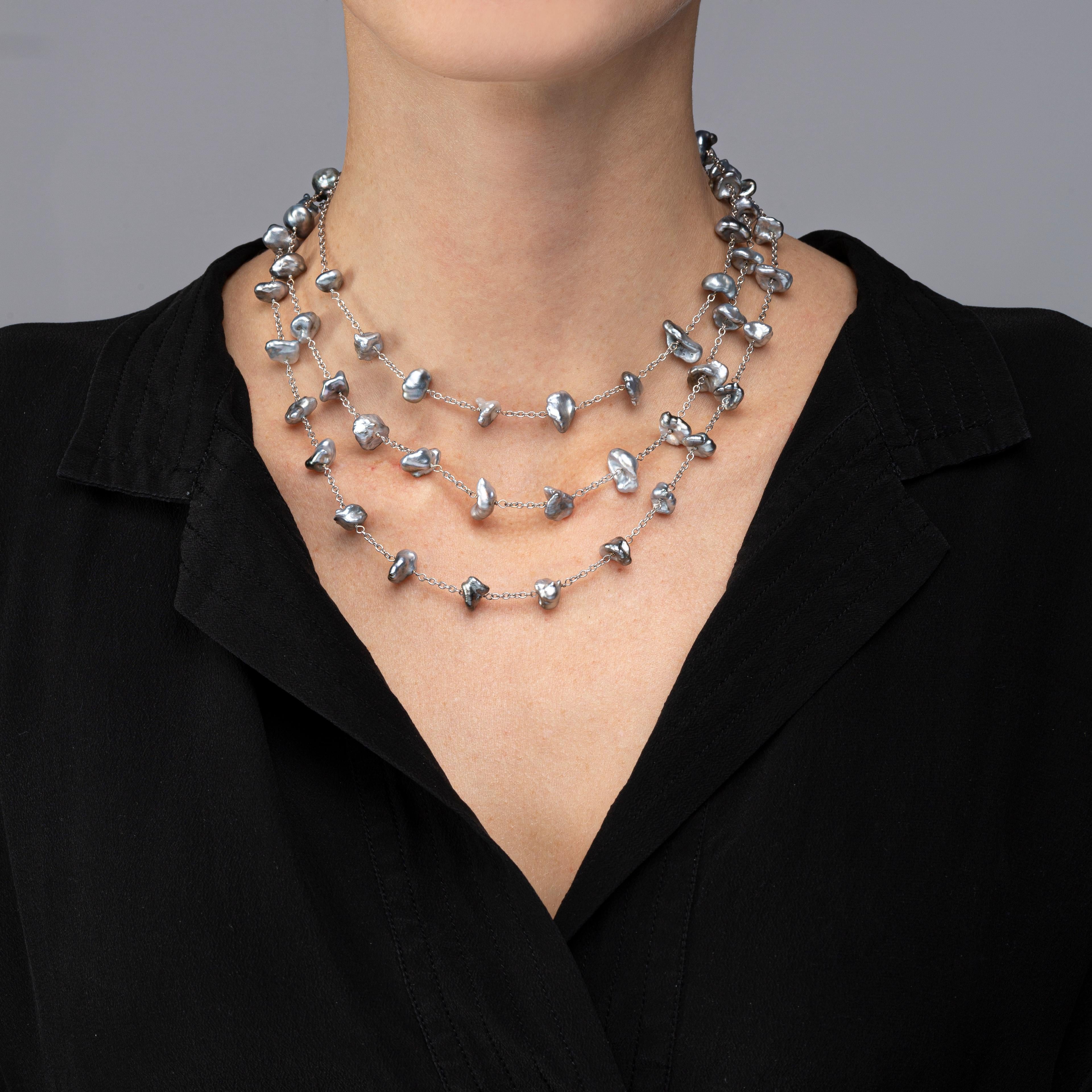 Alex Jona design collection, hand crafted in Italy, 18 karat white gold, 51.18 in /130 cm long sautoir necklace featuring 59 keshi light grey Tahiti pearls.

Alex Jona jewels stand out, not only for their special design and for the excellent quality