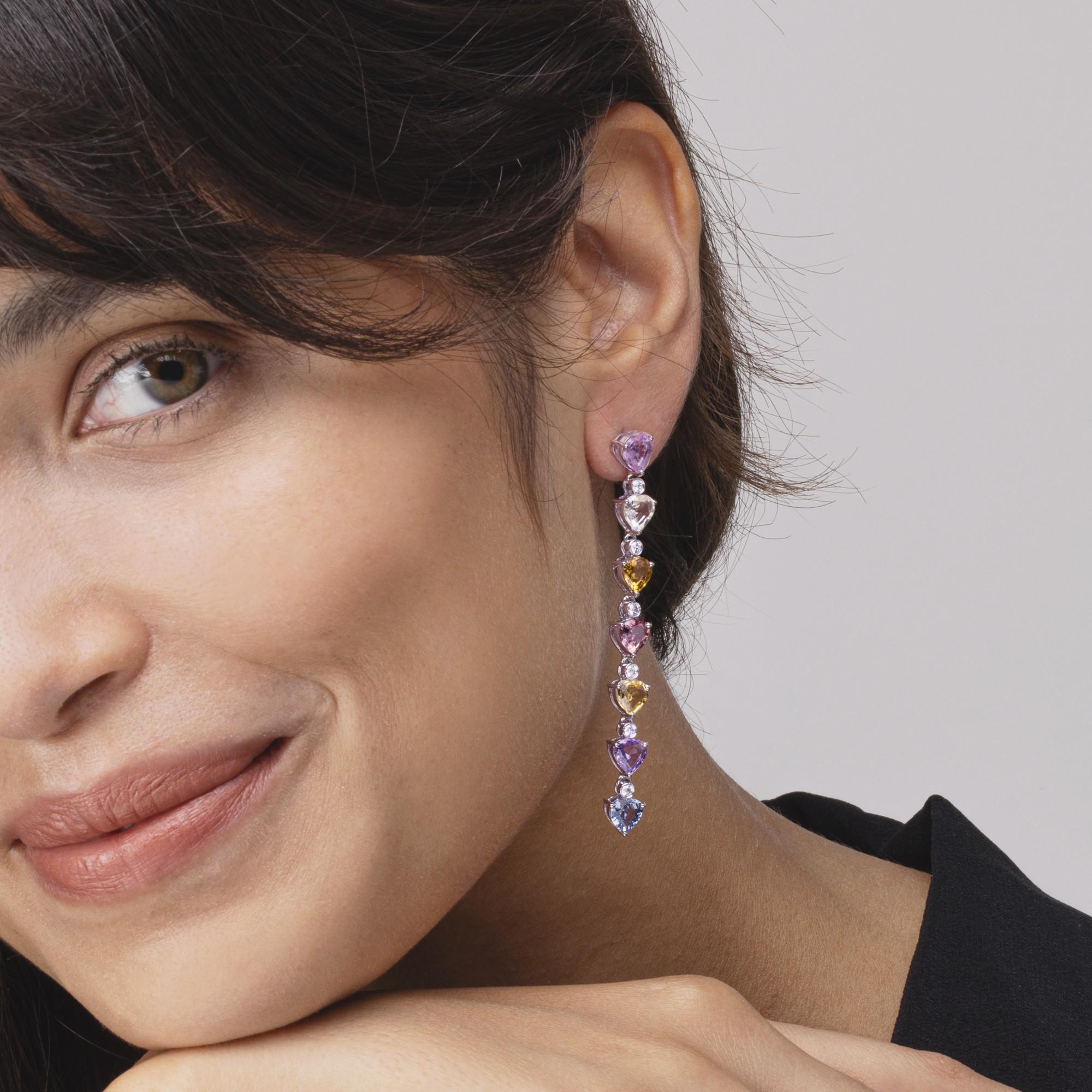 Alex Jona design collection, hand crafted in Italy,  long drop earrings consisting of a waterfall of 14 multicolor drop shape multicolor sapphires, weighing 12.17 carats in total and 12 white diamonds for total carats 0.49.

Alex Jona jewels stand