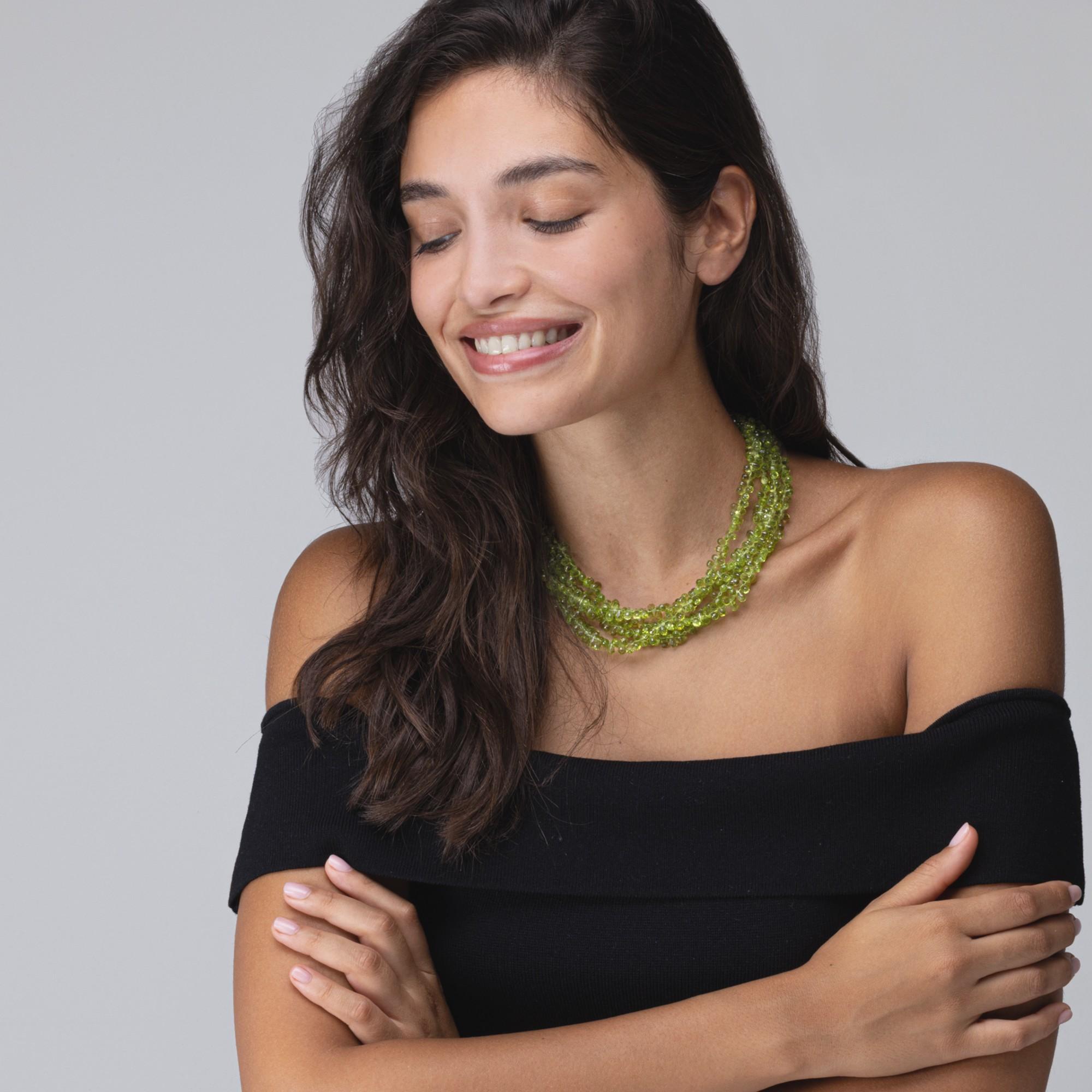 Alex Jona design collection, hand crafted in Italy, 18 karat yellow gold multi-strand necklace of peridots 18 karat yellow gold .

Alex Jona jewels stand out, not only for their special design and for the excellent quality of the gemstones, but also
