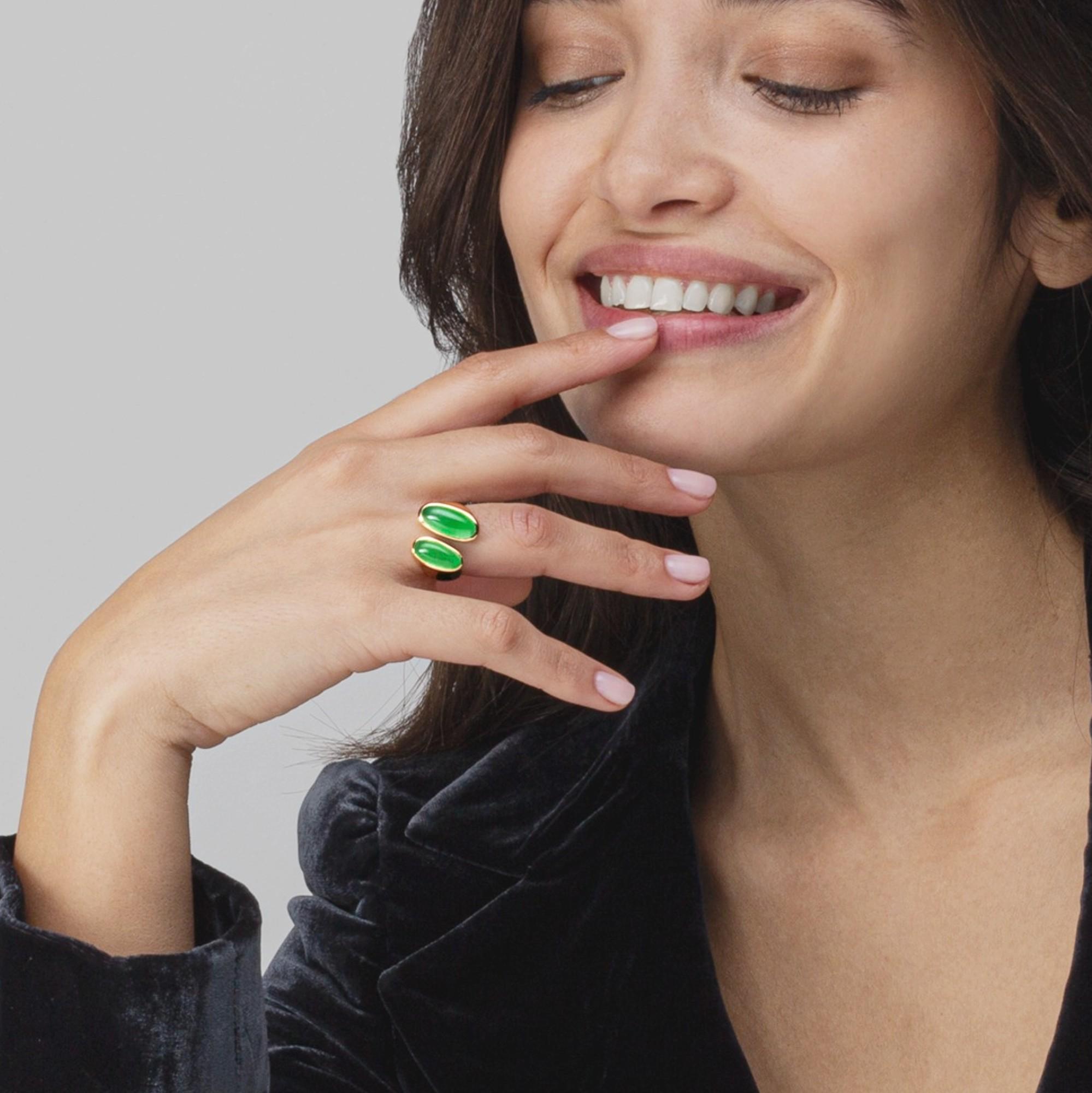 Alex Jona design collection, hand crafted in Italy, 18 karat yellow gold ring, set with two natural Burmese Jadeite Jade cabochons weighing 6.54 carats in total. Ring size US 6.5- EU 12, can be sized to any specification. 
Alex Jona jewels stand