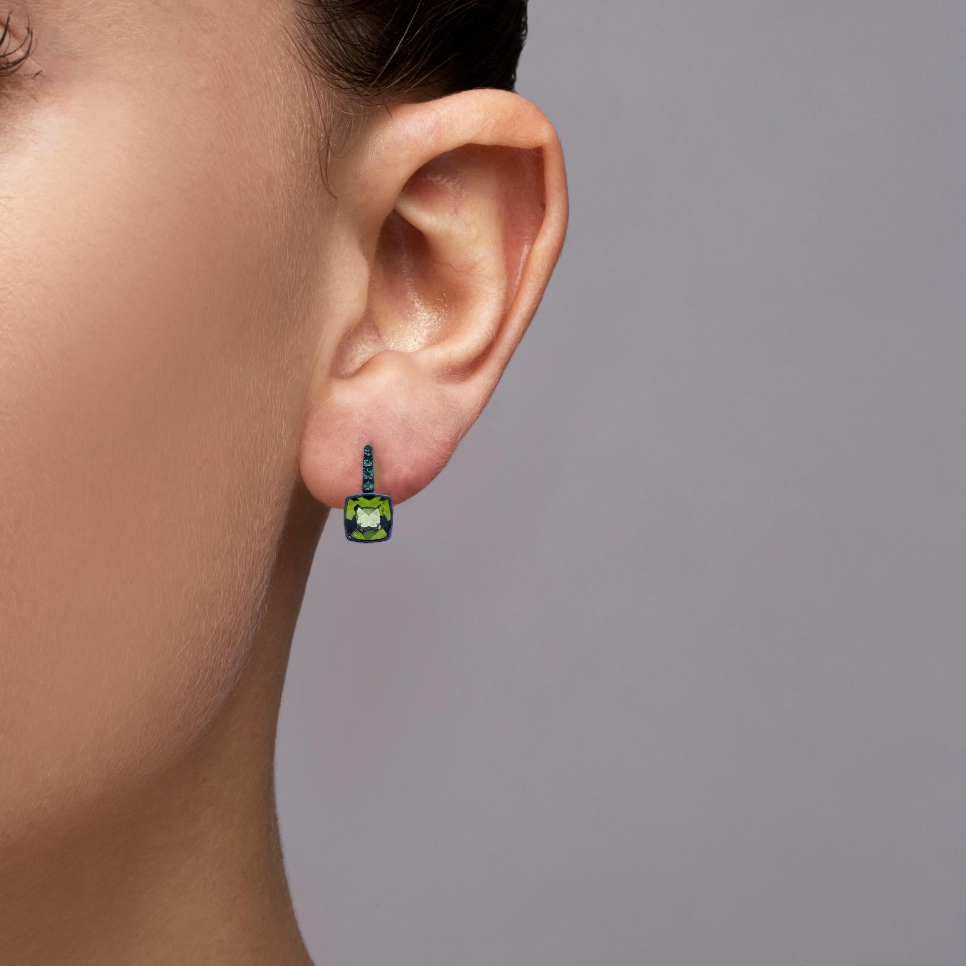 Alex Jona design collection, hand crafted in Italy, 18 karat white gold stud earrings with Black Rhodium, set with two square cut peridots weighing 3.35 carats in total, surrounded by 0,79 carats of round cut tsavorites. Black rhodium