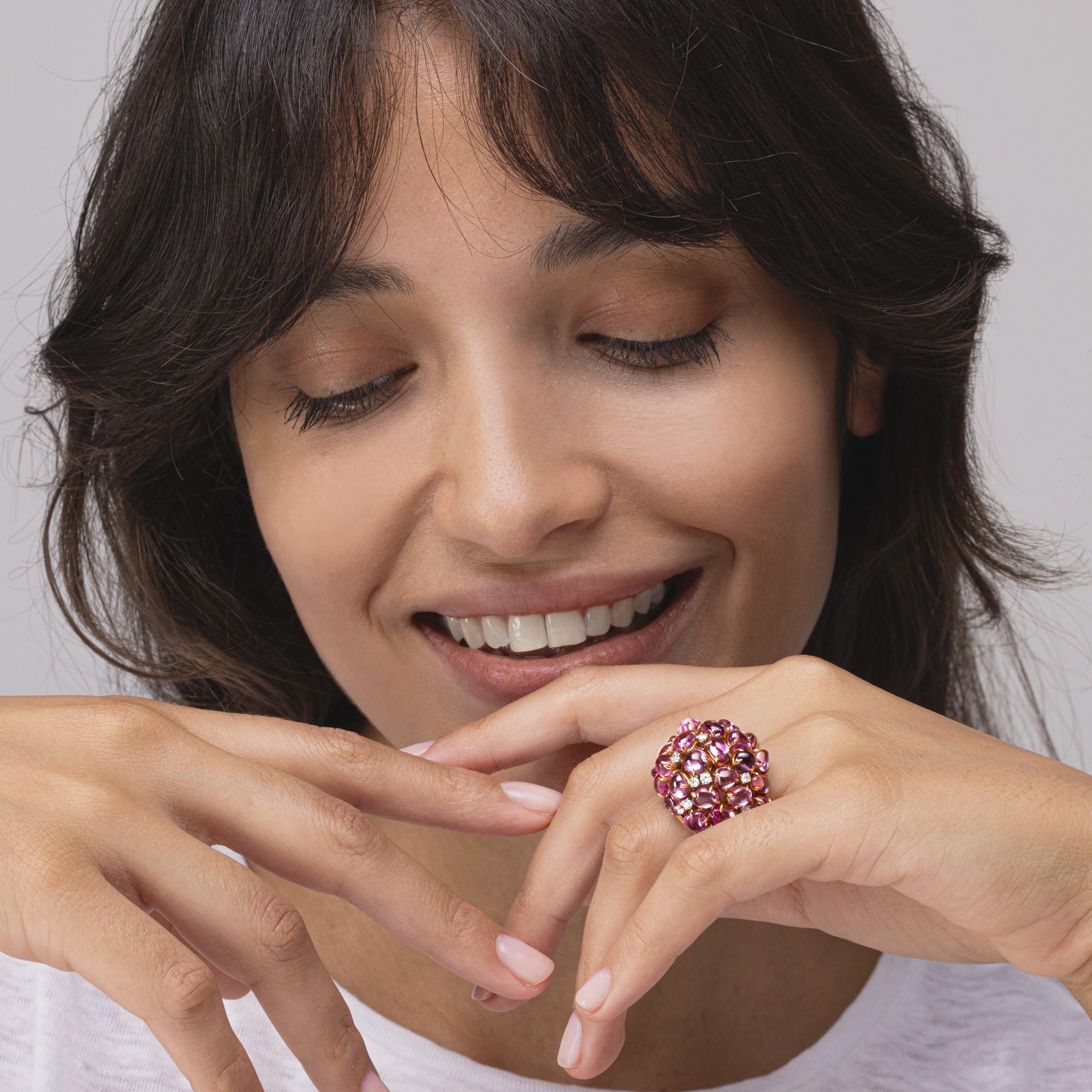 A uniquely hand crafted in Italy dome ring by Alex Jona, featuring 23,02 carats of cabochon cut pink sapphires of multiple shapes and sizes, 0.50 carats of brilliant cut diamonds set in 18K rose gold. Ring size US 6.5- EU 12. Can be sized to any
