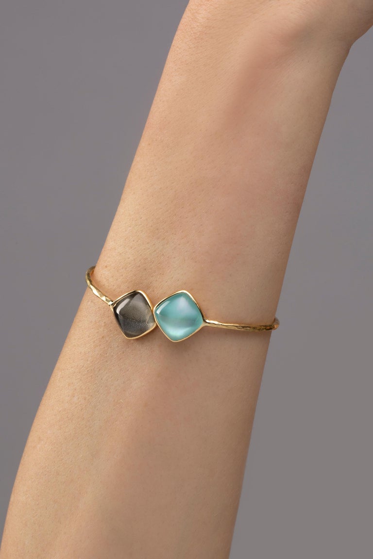 Alex Jona design collection, hand crafted in Italy, 18 Karat yellow gold, rock crystal over quartz and turquoise crazy cut bangle bracelet, weighing 15.02 carats in total. 

Alex Jona jewels stand out, not only for their special design and for the