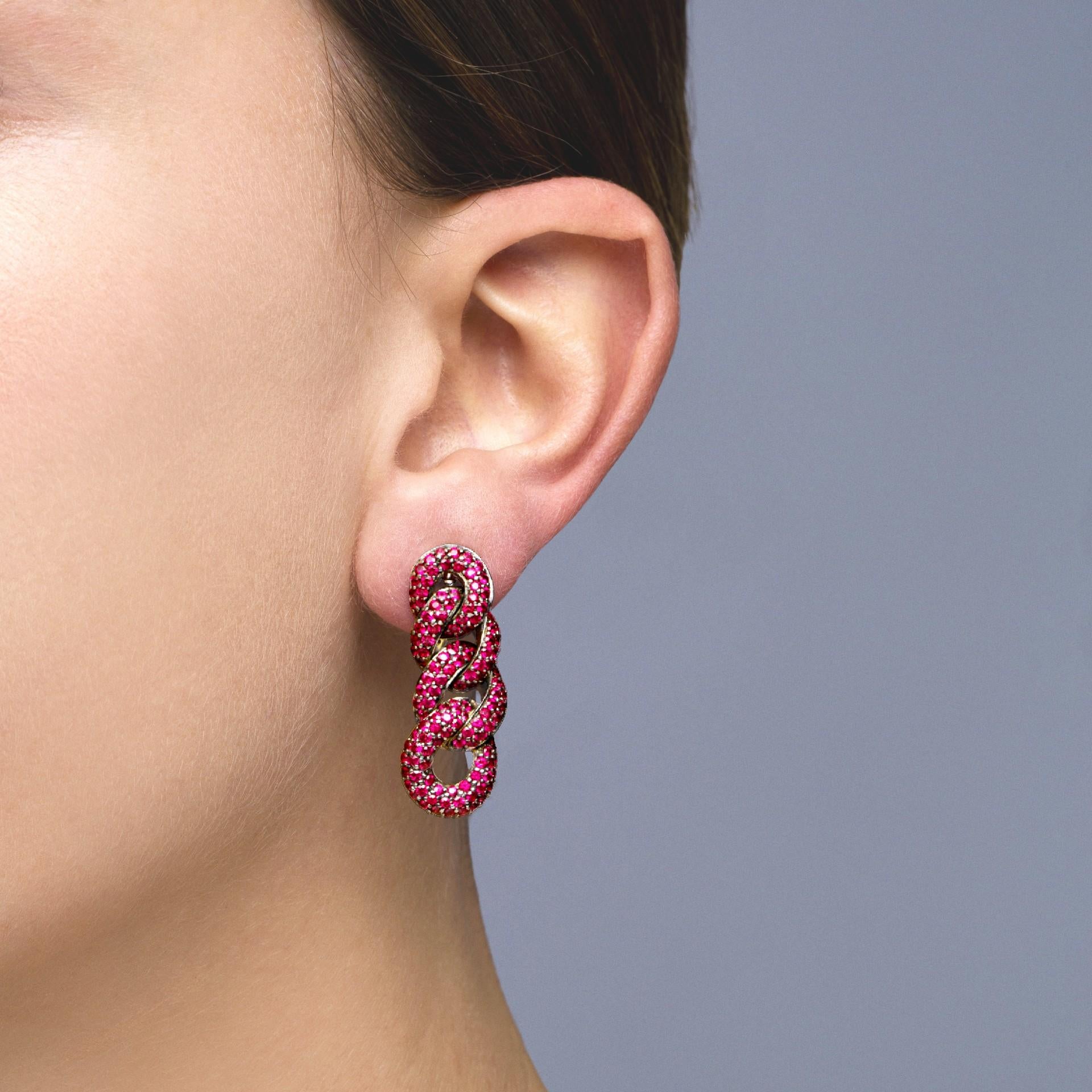 Alex Jona design collection, hand crafted in Italy, 18k white gold curb link chain clip earrings set with 4.58 carats of rubies with black rhodium setting. 
Dimensions: L 1.32in/33.48mm, W 0.49in/12.59mm, D 0.21in/5mm.

Alex Jona jewels stand out,