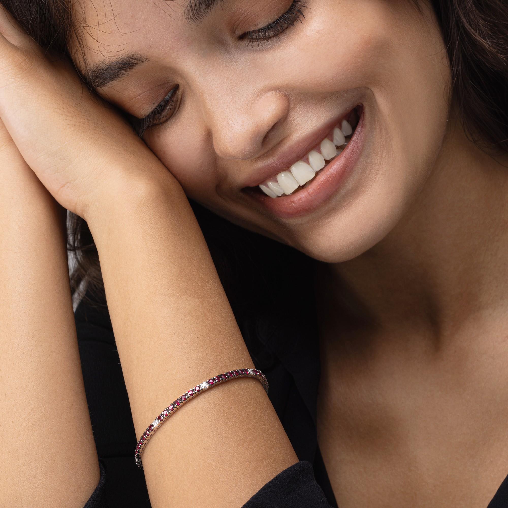 Alex Jona design collection, hand crafted in italy, 18 karat white gold tennis bracelet set with 52 rubies weighing 3.65 carats and 7 white diamonds weighing 0.37 total carats.

Alex Jona jewels stand out, not only for their special design and for