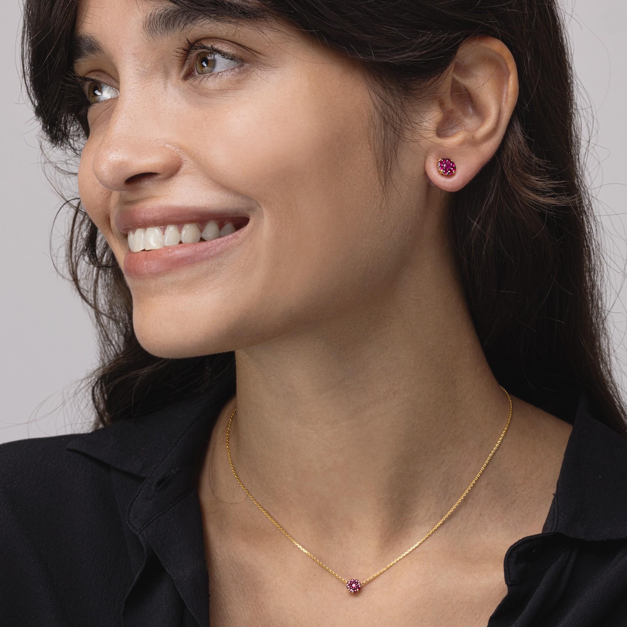 Alex Jona design collection, hand crafted in Italy, 18 Karat yellow gold chain necklace suspending a round pendant  set with 0.30 carats of round cut natural rubies.

Alex Jona jewels stand out, not only for their special design and for the
