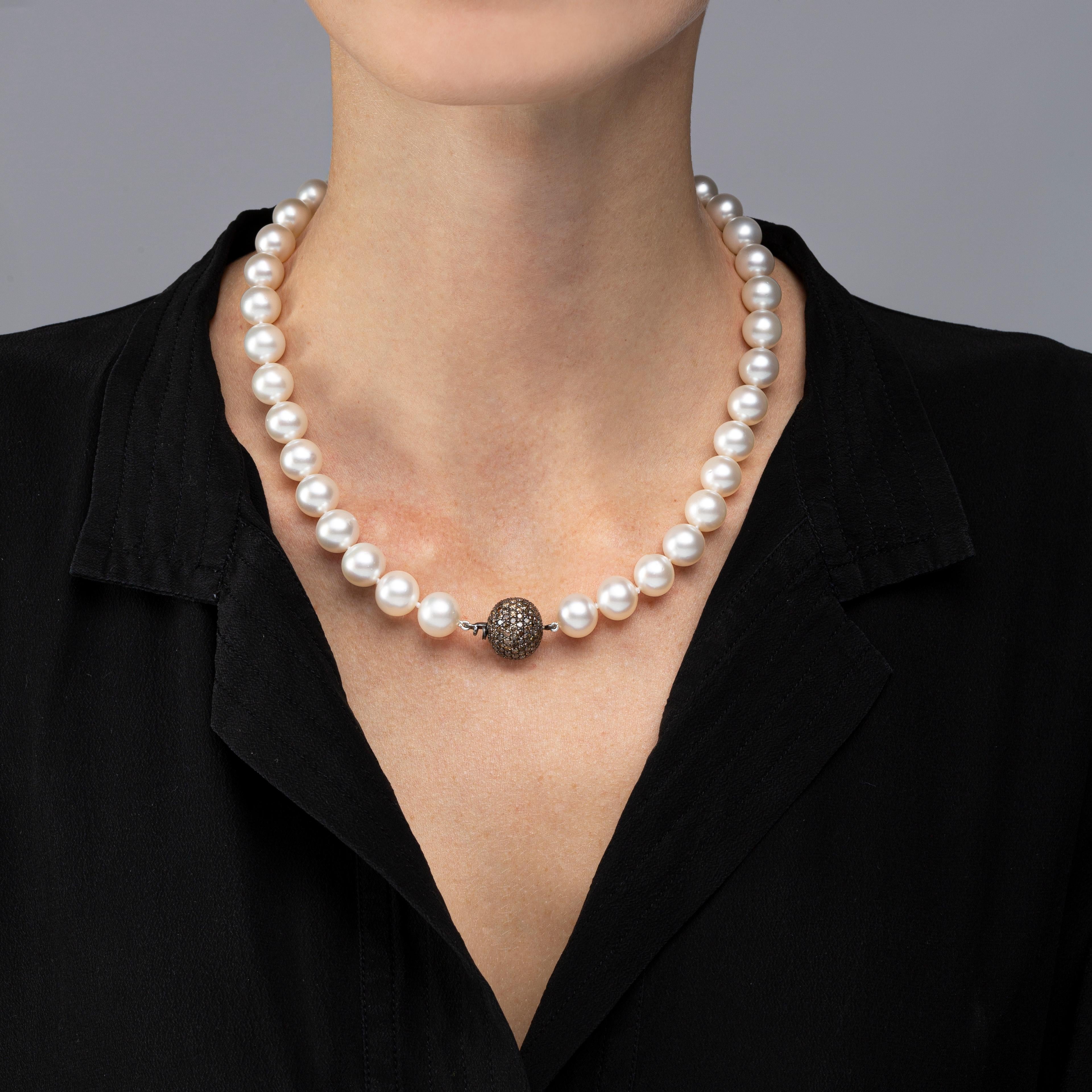 Alex Jona South Sea pearl necklace ( total length 18.5 inch/47 cm), composed of 39 cultured South Sea pearls ranging from  10.2 to 12.7 mm in diameter, strung on a hand-knotted silk cord and secured by a brown diamond pavé ball clasp (212 pieces,