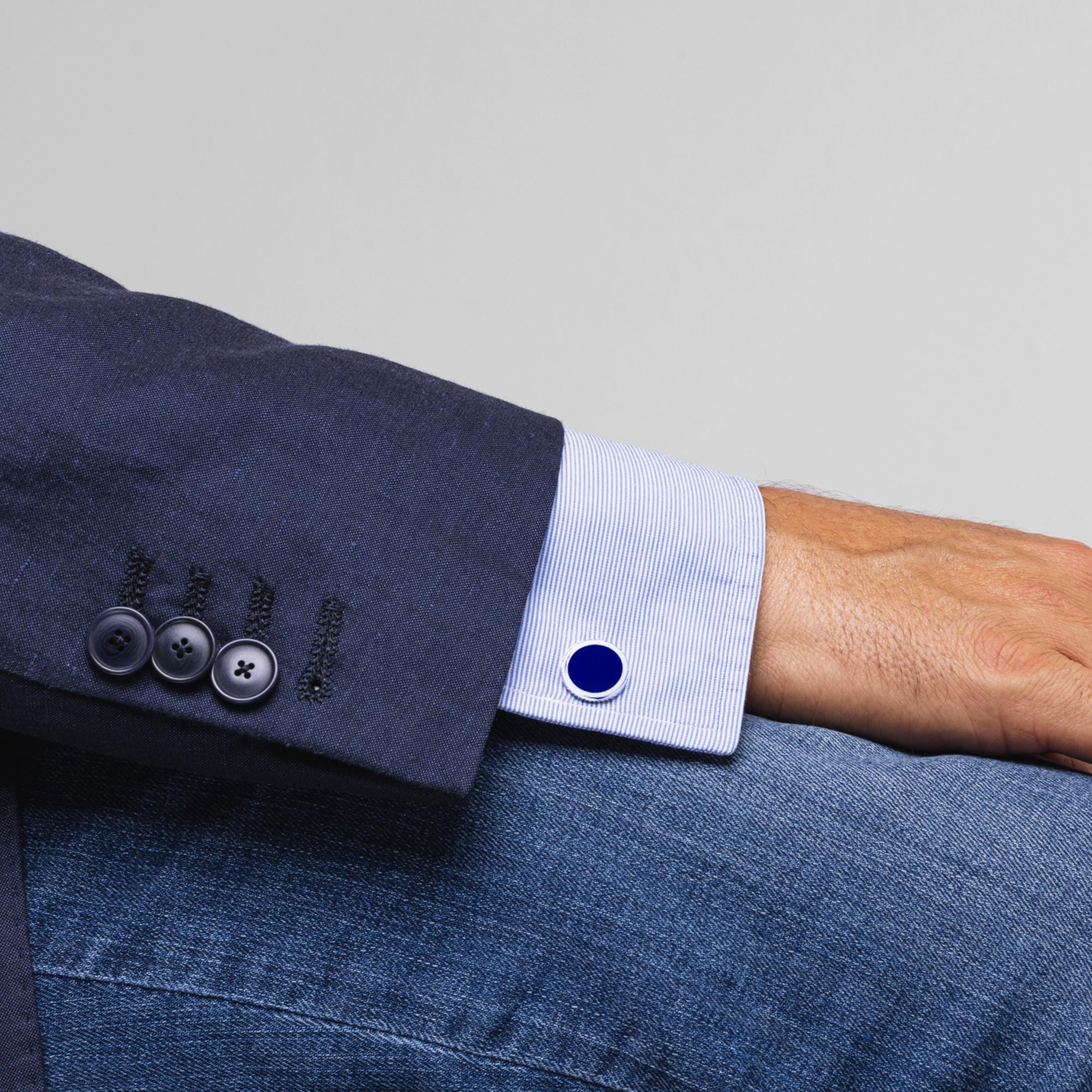 Alex Jona design collection, hand crafted in Italy, rhodium plated Sterling Silver cufflinks with blue enamel. These cufflinks feature a T-Bar fastening, aiding in easy use and confidence that they'll stay secured to your shirt. Dimensions: Diameter