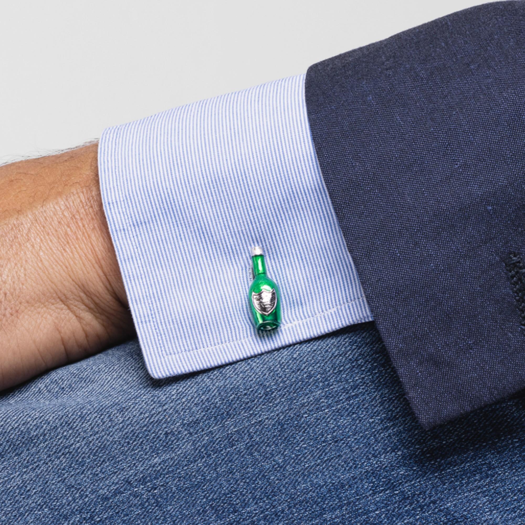 Celebrate with Alex Jona champagne bottle cufflinks!
These sophisticated green champagne bottle cufflinks are perfect for special occasions. They have been designed by Alex Jona, hand crafted in Italy in sterling silver with green enamel and feature