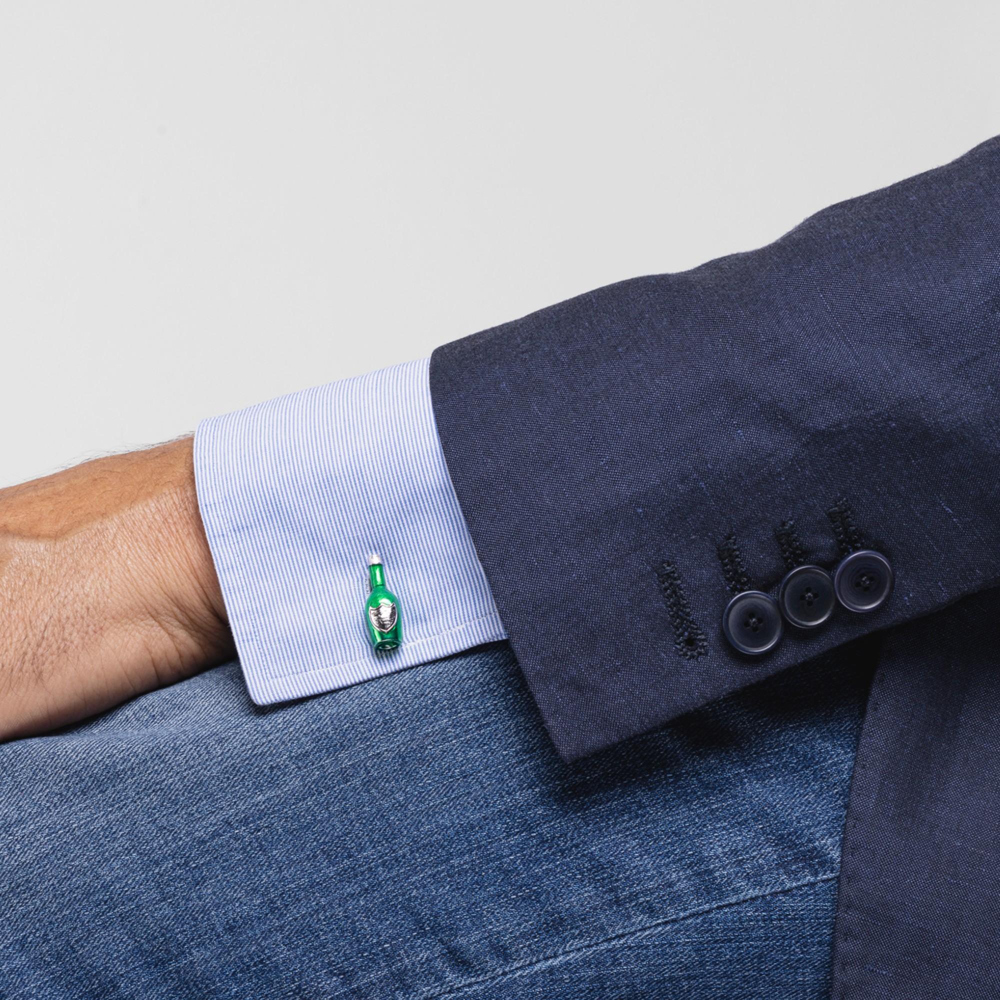 Celebrate with Alex Jona champagne bottle cufflinks!
These sophisticated green champagne bottle cufflinks are perfect for special occasions. They have been designed by Alex Jona, hand crafted in Italy in sterling silver with green enamel and feature