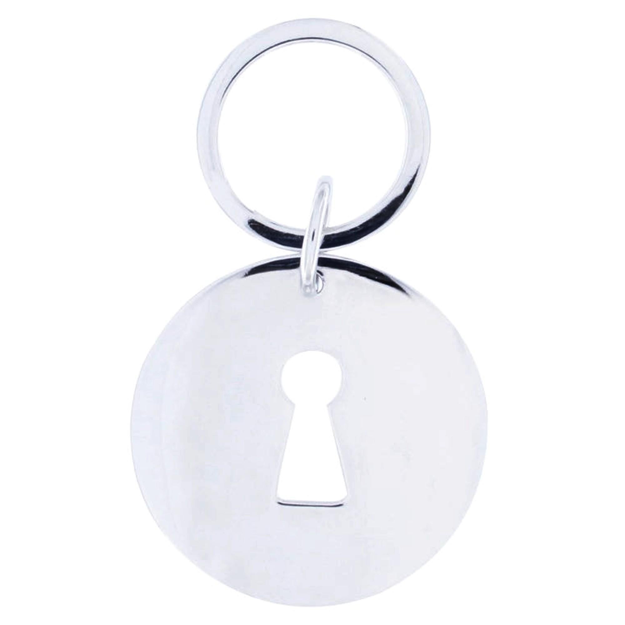 Alex Jona design collection, hand crafted in Italy, rhodium plated Sterling Silver key hole key holder.Dimensions: Diameter: 1.70 in/43 mm, Depth: 0.06 in./1.61 mm

Alex Jona gifts stand out, not only for their special design and for the excellent