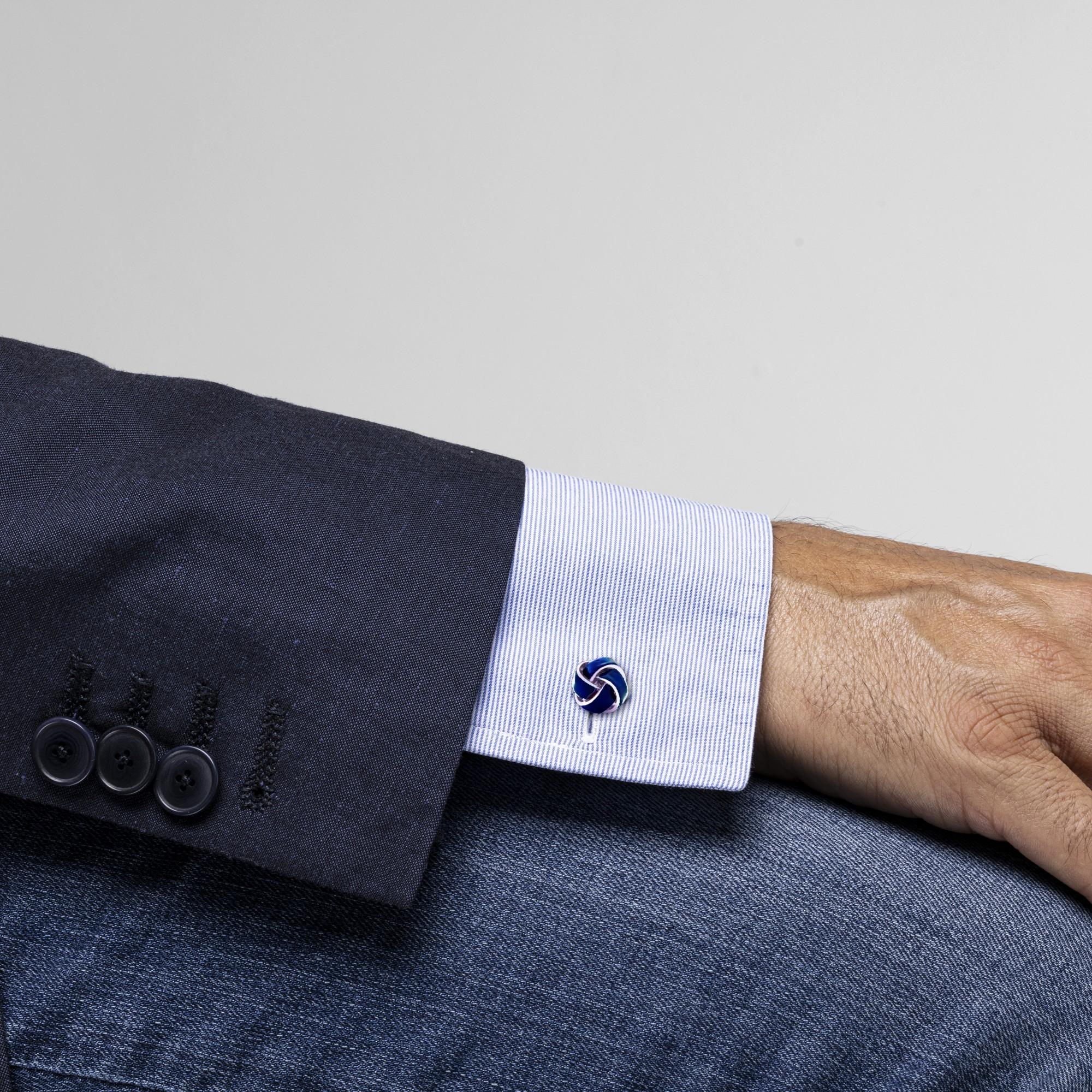 Alex Jona design collection, hand crafted in Italy, sterling silver knot cufflinks with petroleum blue enamel. These cufflinks feature a T-Bar fastening, aiding in easy use and confidence that they'll stay secured to your shirt. Dimensions: 