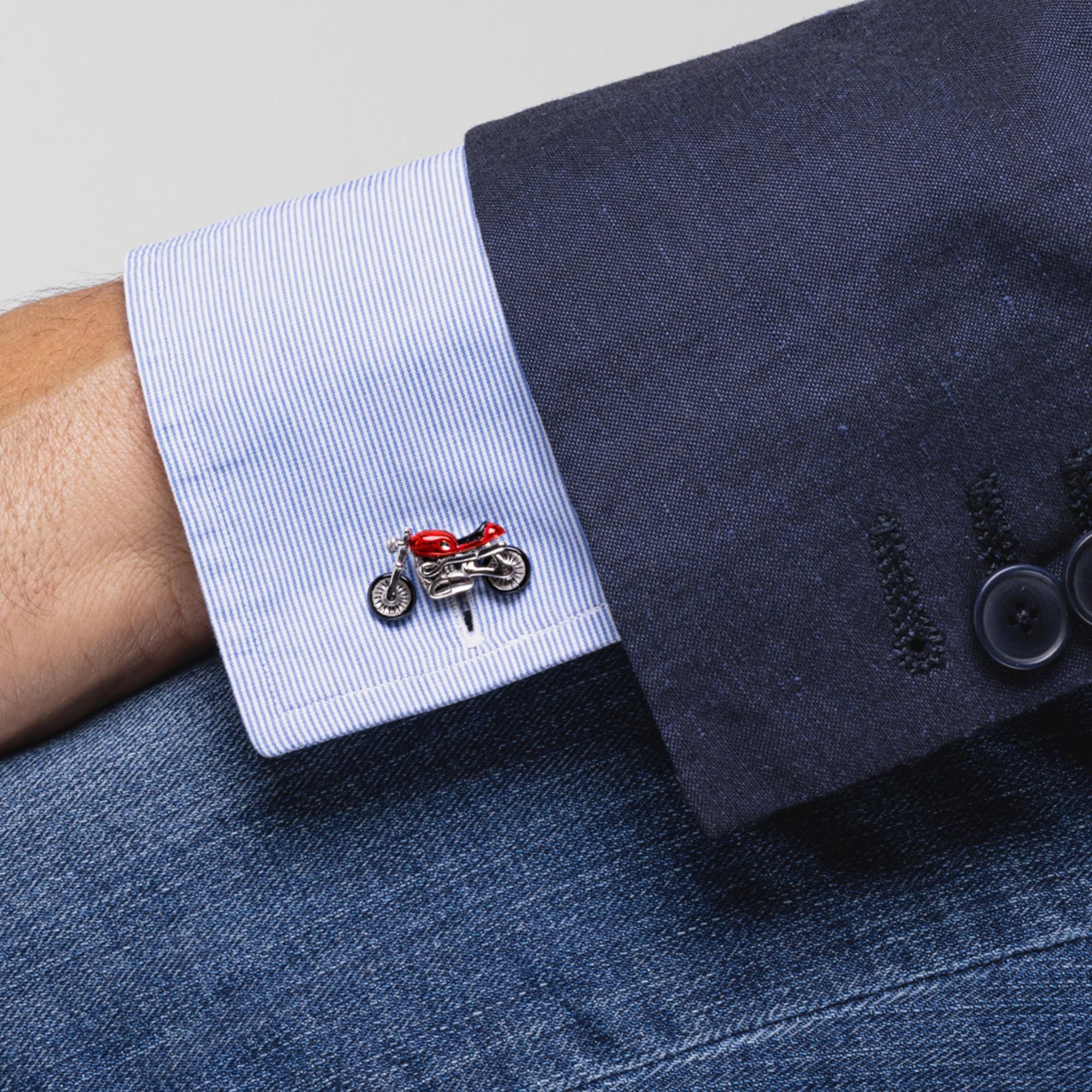 Alex Jona design collection, hand crafted in Italy, sterling silver orange enamel motorcycle cufflinks. The seat is in onyx. Marked JONA. Dimensions 0.95 in W x 0.52 in H

Alex Jona cufflinks stand out, not only for their special design and for the