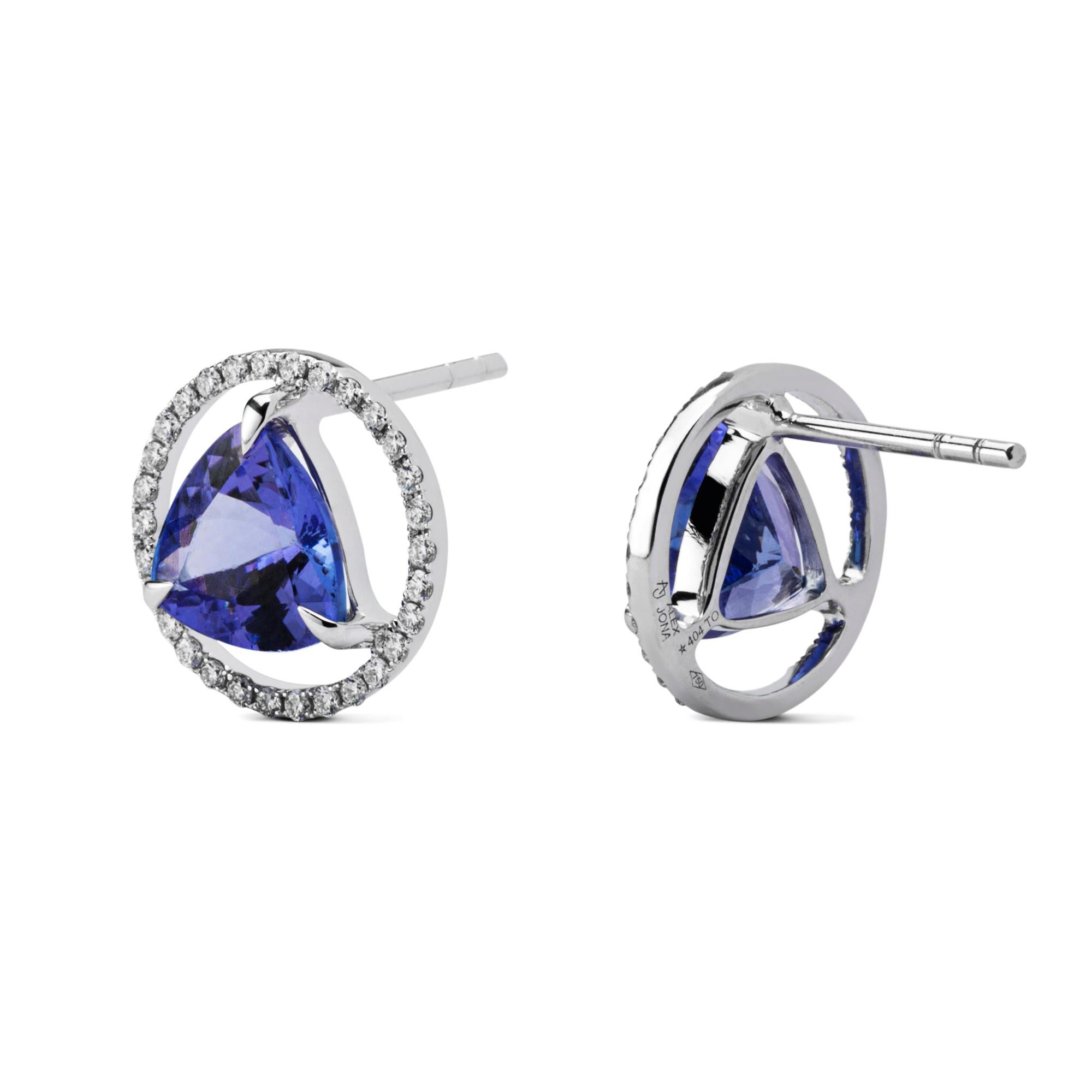 Alex Jona design collection, hand crafted in Italy, 18 karat white gold stud earrings set with two trillion cut Tanzanite weighing 3.94 carats, surrounded by 60 brilliant cut white diamonds, F color, VVS1 clarity, weighing 0.39 carats. Earrings