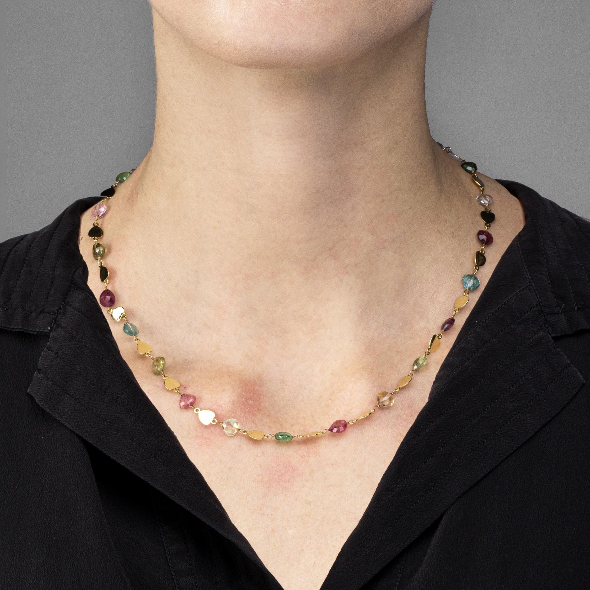 Alex Jona design collection, hand crafted in Italy, 18 karat yellow gold necklace, alternating heart shape multicolor faceted tourmalines with gold heart links.

Alex Jona jewels stand out, not only for their special design and for the excellent