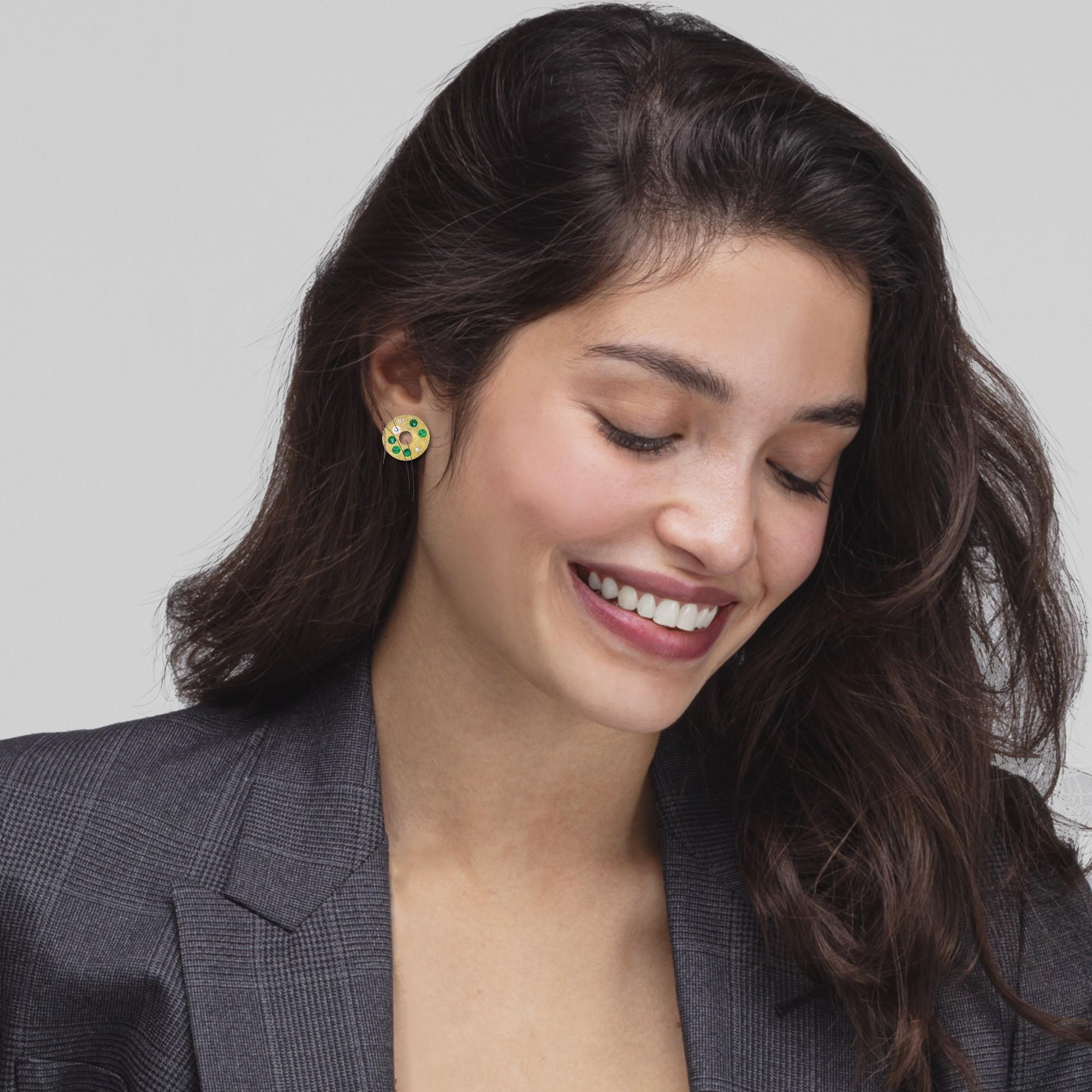 Alex Jona design collection, hand crafted in Italy, 18 karat brushed yellow gold stud earrings set with 0.71 carats of round cut Tsavorite and 0.14 carats  0.62 inch diameter.

Alex Jona jewels stand out, not only for their special design and for