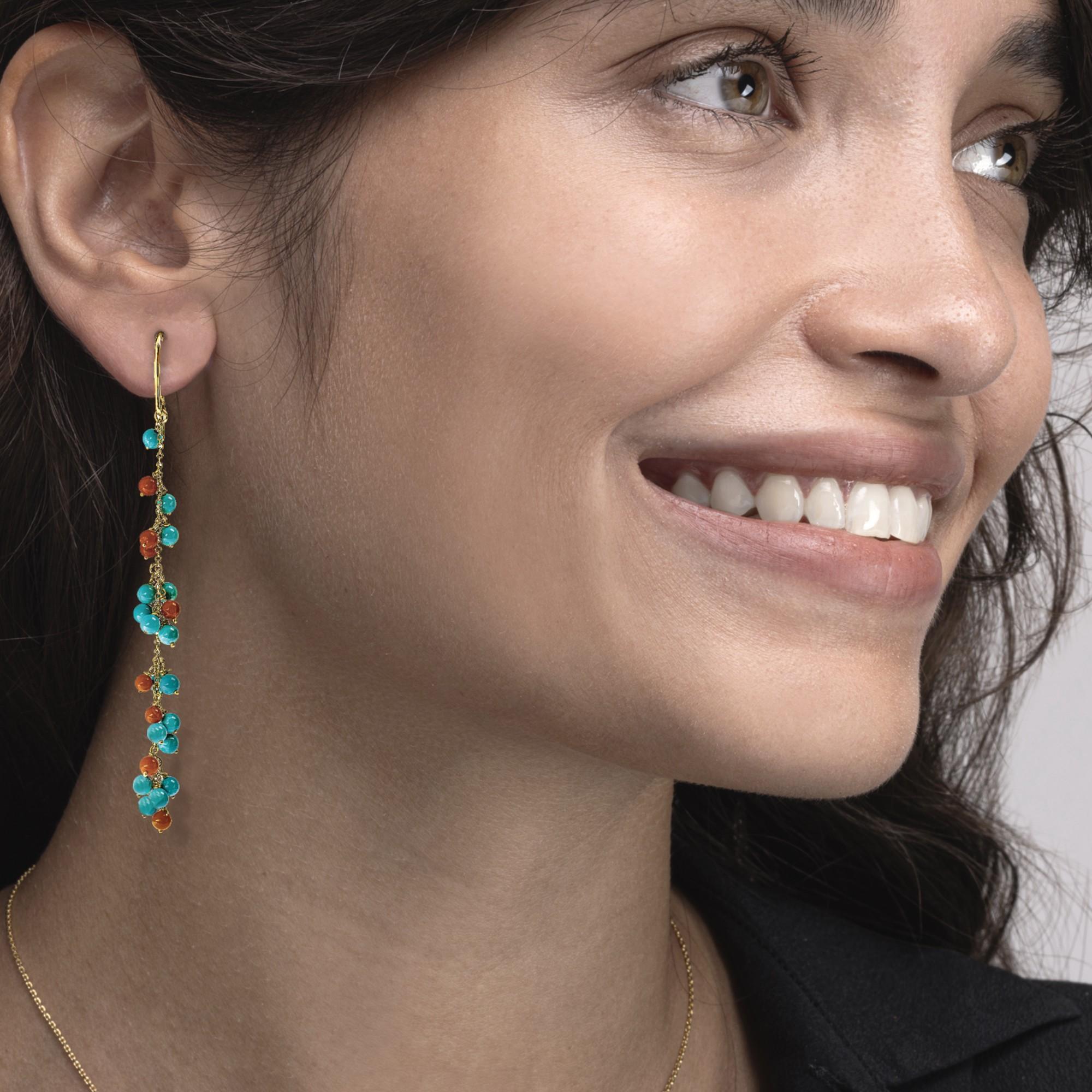 Alex Jona design collection, hand crafted in Italy, 18 Karat yellow gold chandelier earrings suspending Turquoise and Coral bubbles. 
Alex Jona jewels stand out, not only for their special design and for the excellent quality of the gemstones, but