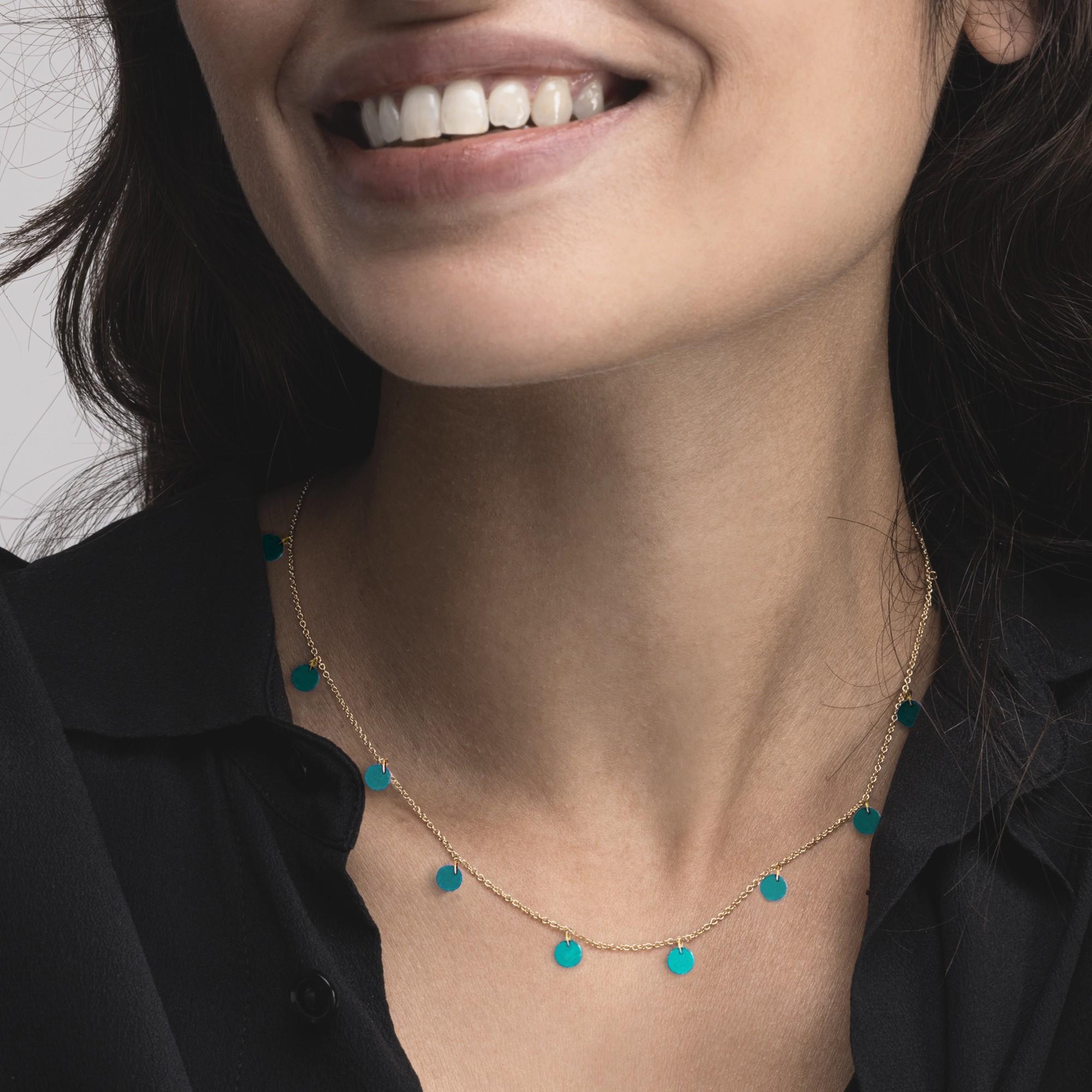 Alex Jona design collection, hand crafted in Italy, 18 karat yellow gold chain necklace suspending 11 turquoise disc pendants. 
Alex Jona jewels stand out, not only for their special design and for the excellent quality of the gemstones, but also