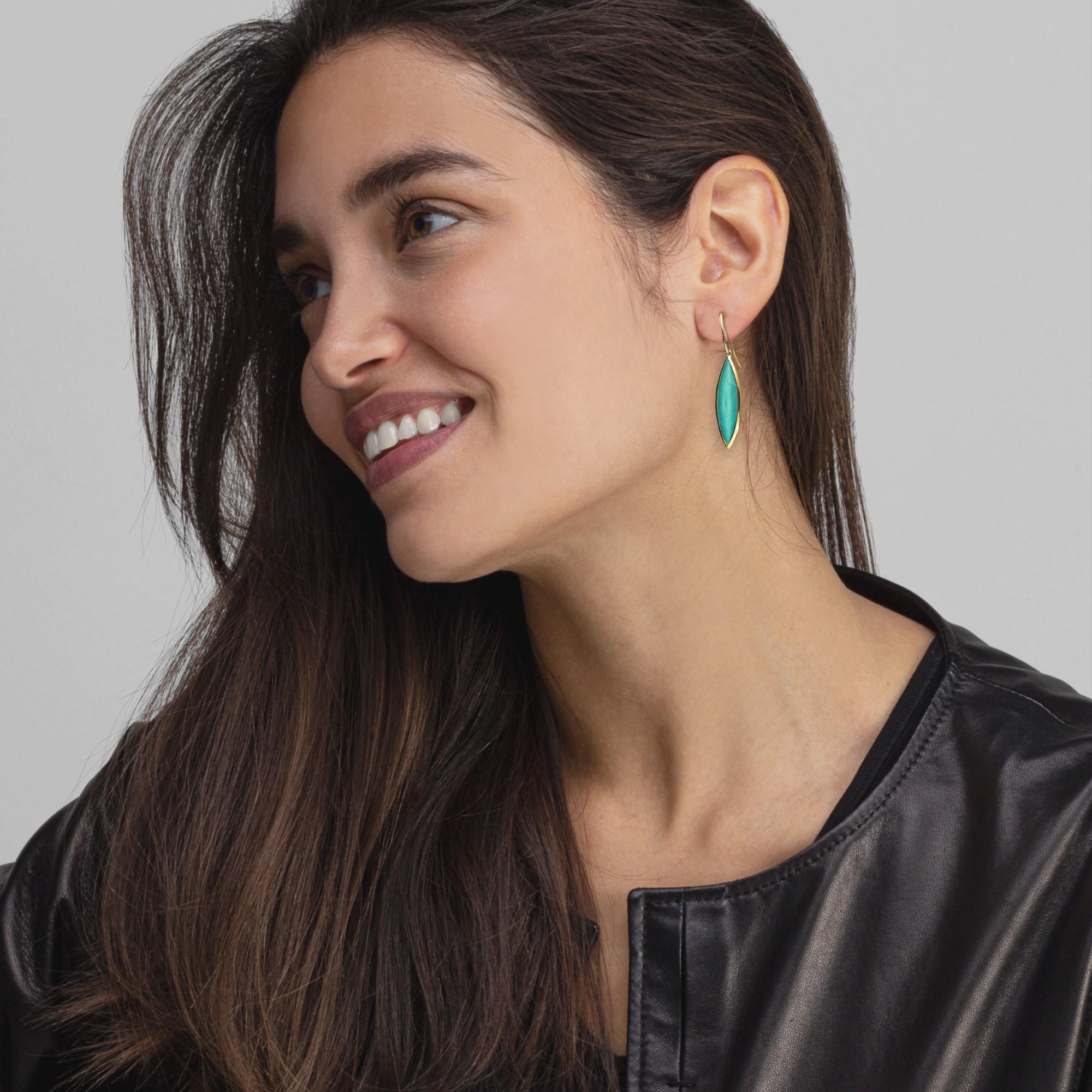 Alex Jona design collection, hand crafted in Italy, 18 Karat yellow gold drop earrings set with a crazy cut Quartz over turquoise weighing 9.36 carats. 
Alex Jona jewels stand out, not only for their special design and for the excellent quality of