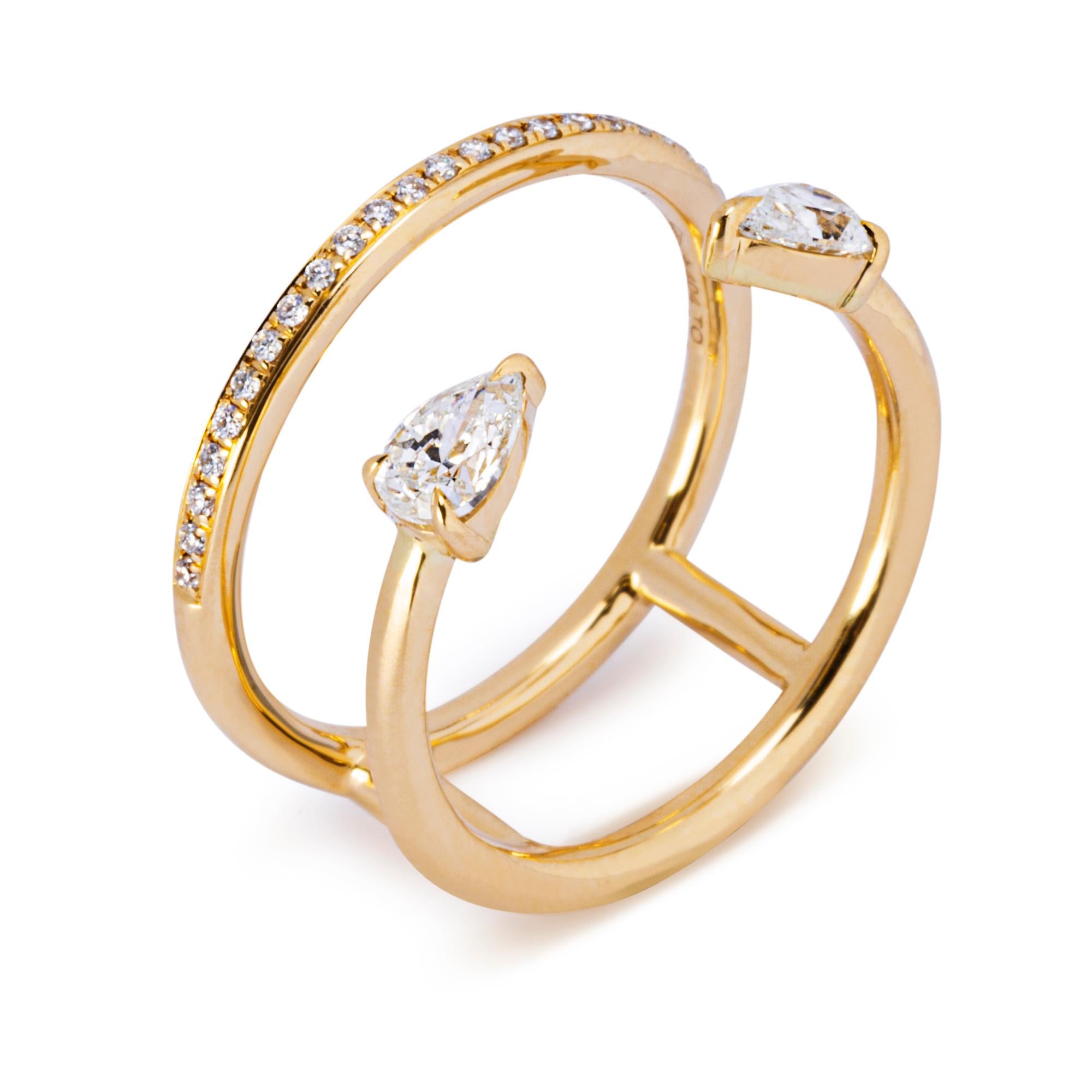 Alex Jona design collection, hand crafted in Italy, 18 Karat yellow gold double open ring band, set with two pear cut diamonds weighing 0.63 carats. The shoulder is set with white diamonds, F color, VVS1 clarity, weighing 0.96 
Alex Jona jewels