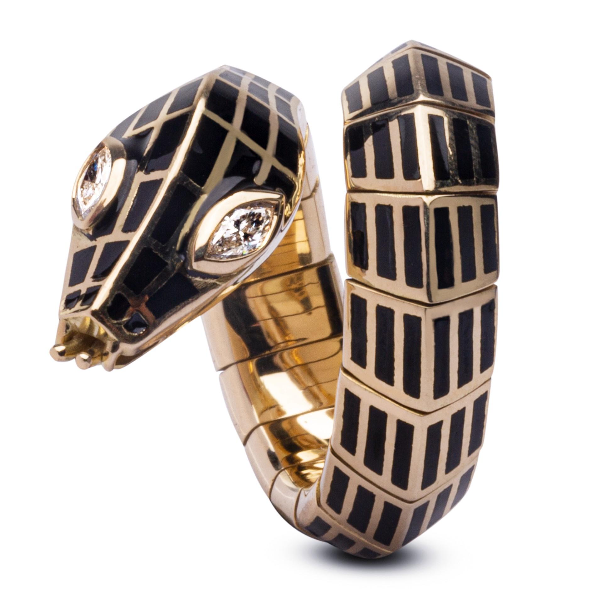 Alex Jona design collection, hand crafted in Italy, stunning 18 karat yellow gold flexible coil snake ring set with 2 marquise cut white diamonds on the head of the serpent weighing 0.17 ct. The body made of flexible gold and black enamel