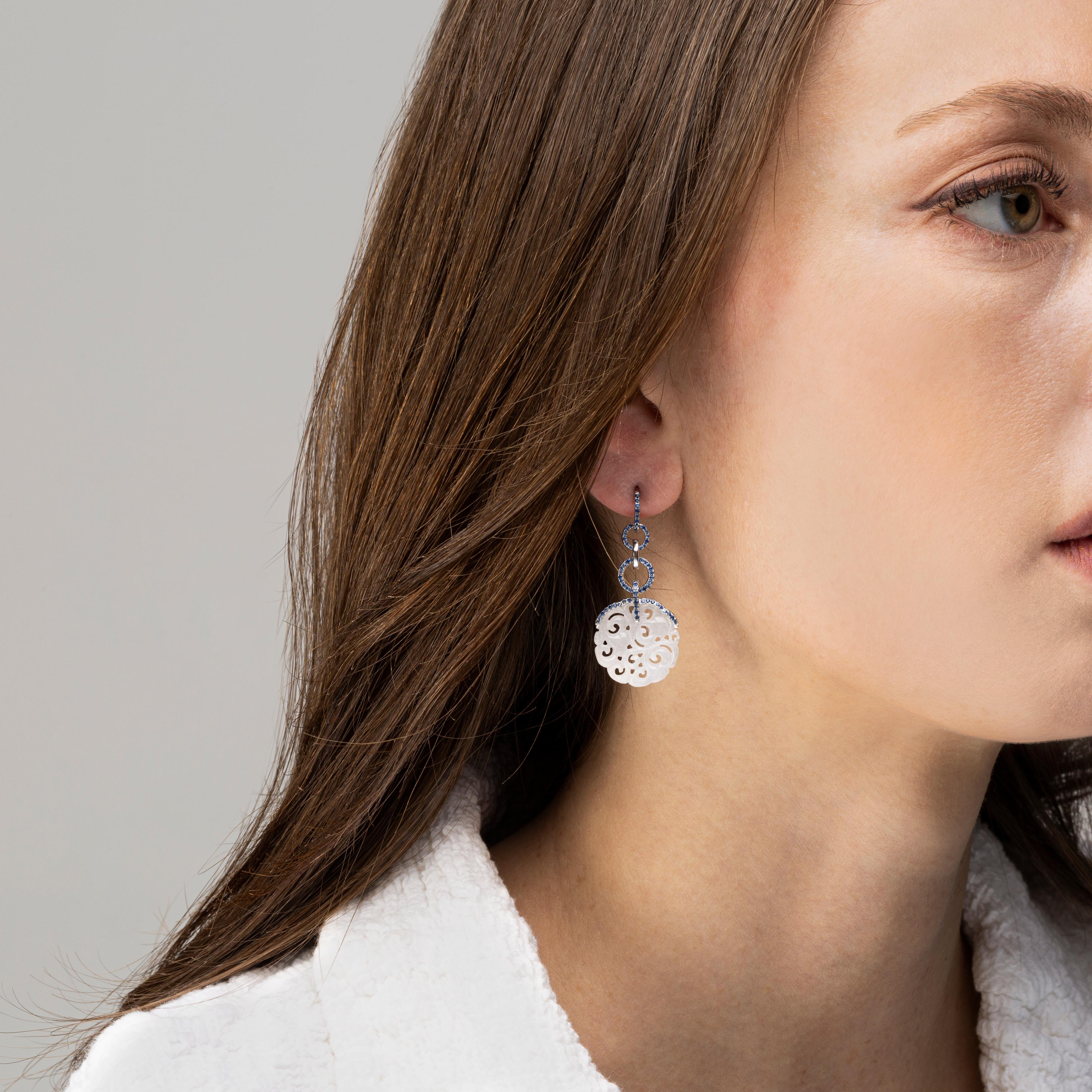 Alex Jona design collection, hand crafted in Italy, drop earrings featuring two carved white jades weighing in total 11.98 carats, set on 18k white gold adorned by 0.86 carats of light blue sapphires.
Dimensions: H 1.56in/39mm, W 0.75in/19mm, D