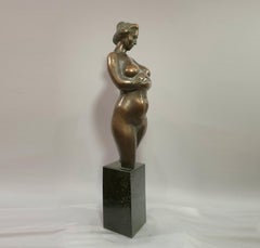 Pregnant woman. vintage bronse sculpture