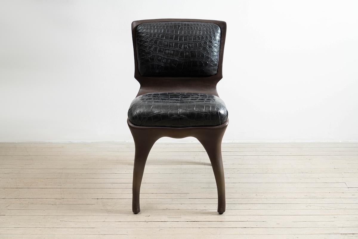 Tusk chair reflects Alex Roskin penchant for an animality in form. The versatile chair can be used as a salon chair, a desk chair, or grouped for a dining set. The chair features an mammalian physicality, hand-sculpted and cast in aluminum. The