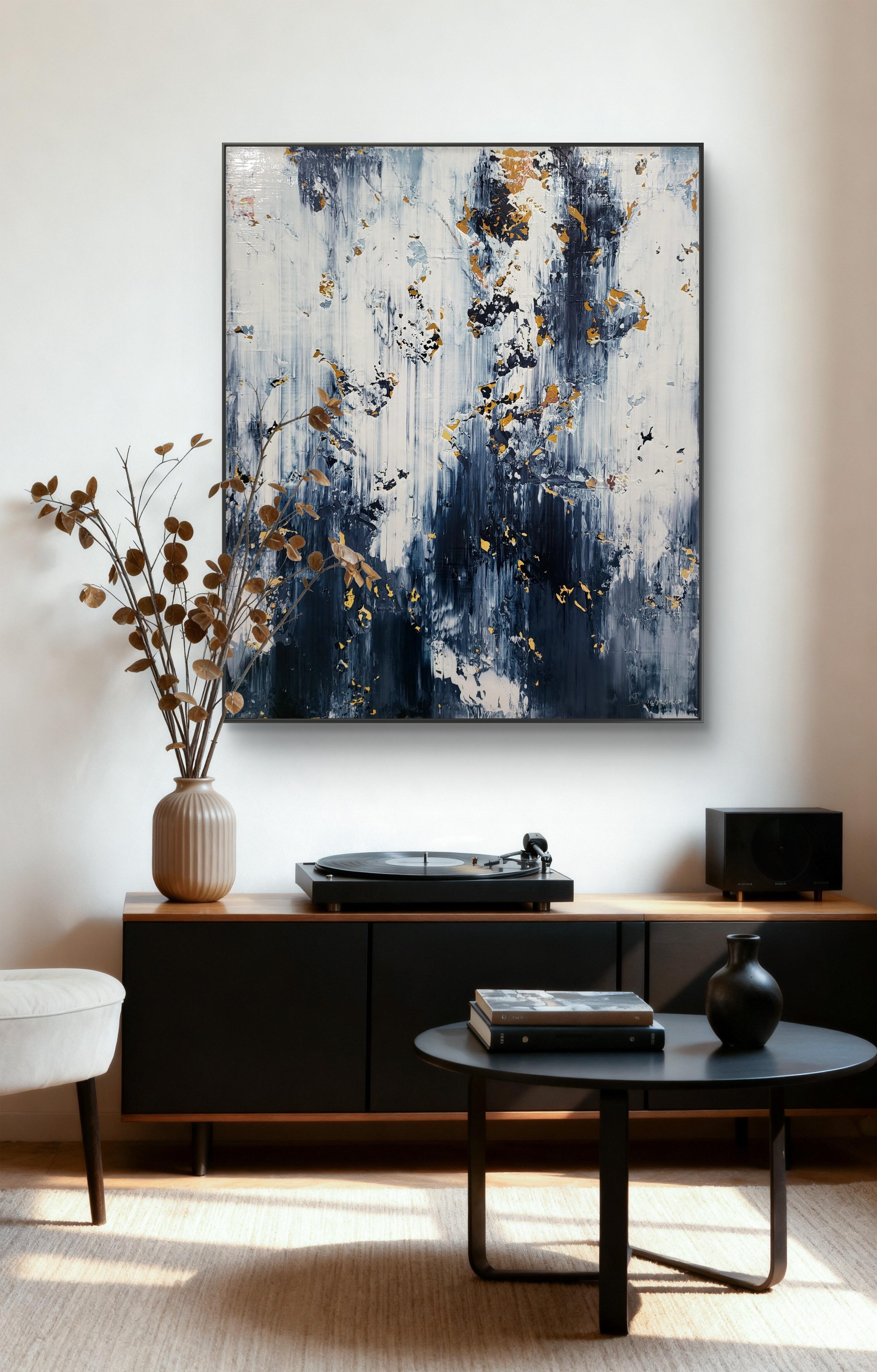 This striking abstract painting captivates with its bold interplay of dark blues, crisp whites, and delicate gold accents. The canvas is dominated by rich navy hues cascading vertically, reminiscent of flowing water or softly falling rain, creating