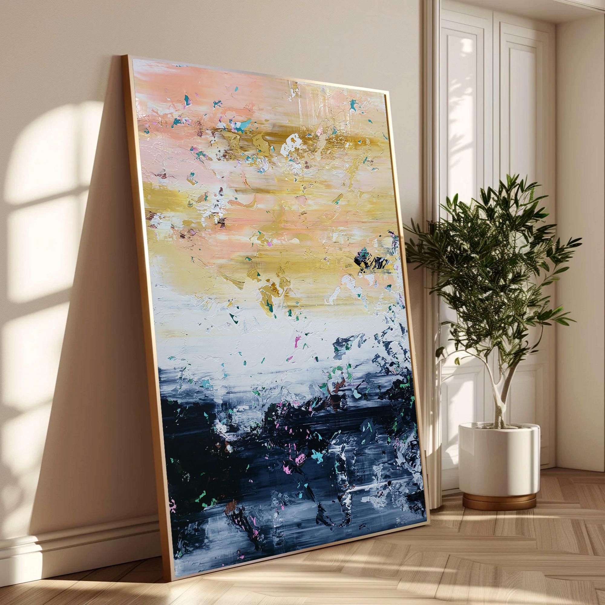 This abstract artwork captivates with its dynamic interplay of color and texture. At the top, warm hues of soft pink and golden yellow blend seamlessly, evoking a serene sunset. Flecks of contrasting bright colors add a playful vibrancy, inviting