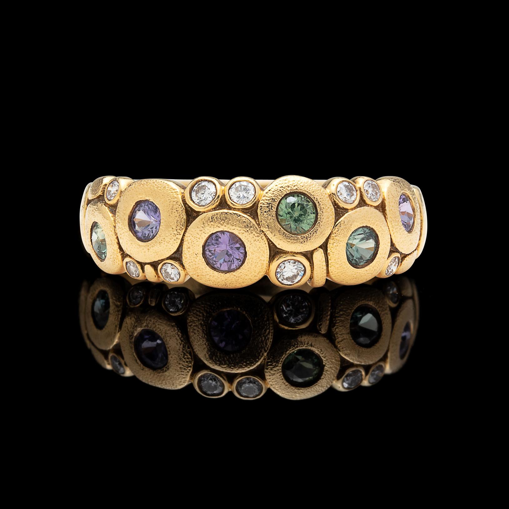 Fun and flirty, the 18k gold ring is one of the most popular styles from famed designer Alex Sepkus. Set with the Pastel Rainbow Mix of 6 round multi-color sapphires and 9 round brilliant-cut diamonds, with a total gem weight of 0.62 carat. The ring