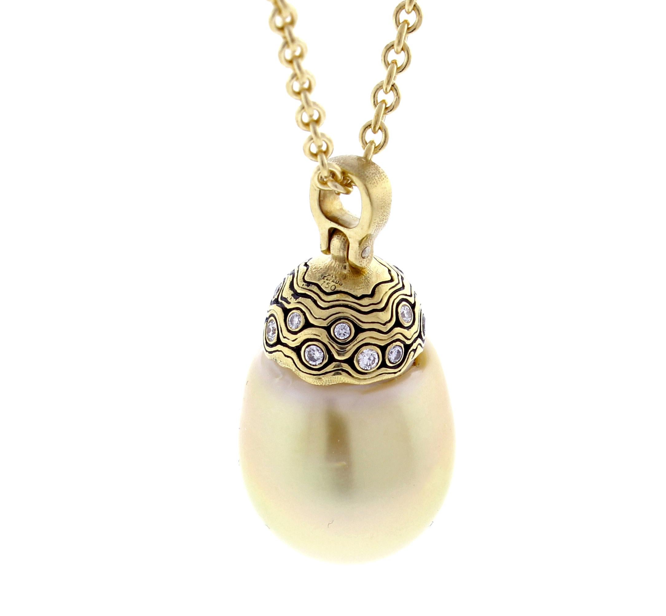 From Alex Sepkus, this golden south sea pearl and diamond pendant necklace. The 18 karat pendant boasts a  south sea peal measureing 21 x 16mm and 14 diamonds weighing .30 carats. 18 inches