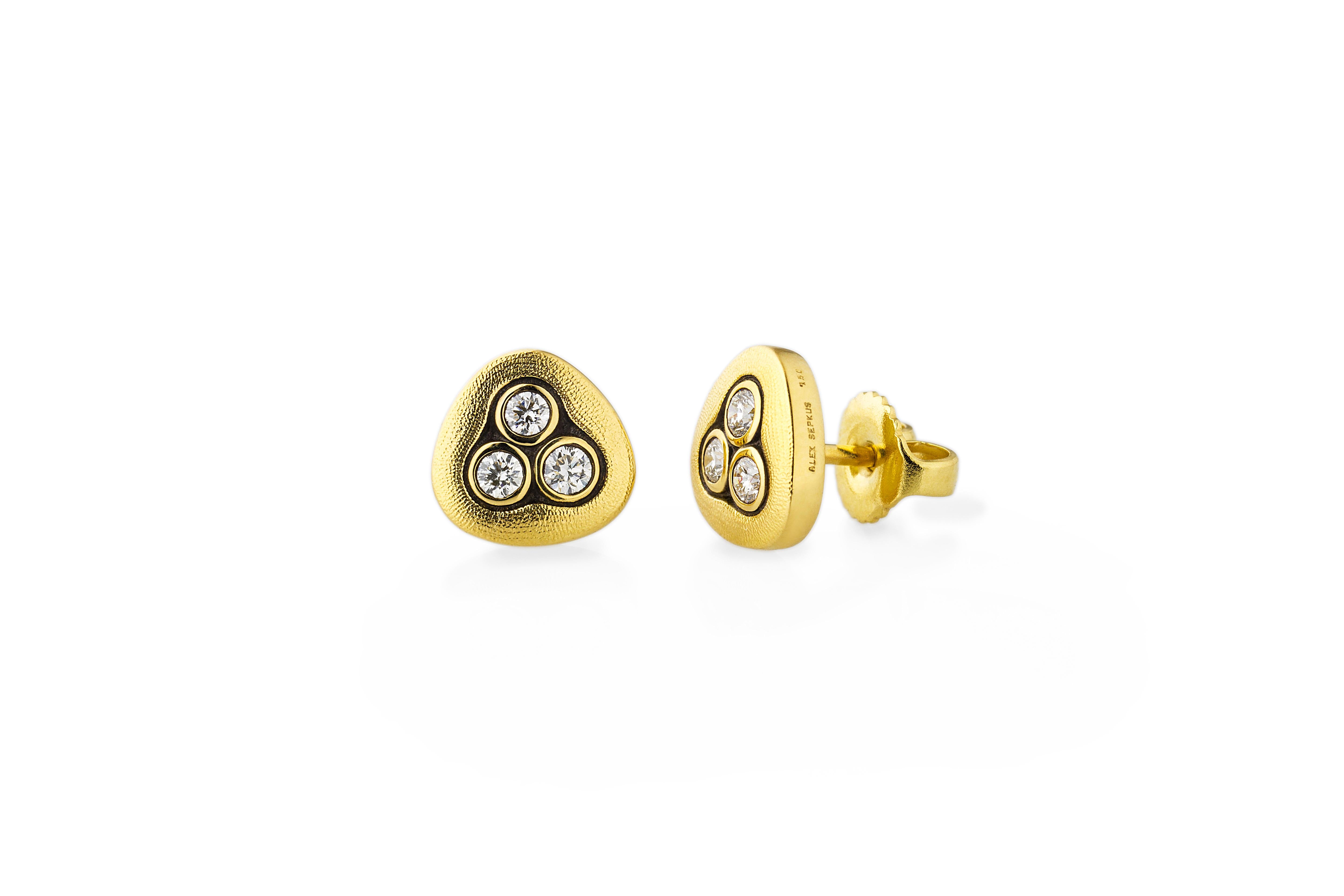 18K Gold Alex Sepkus Diamond Swirling Water Studs.  These beautiful earrings have 6 round brilliant diamonds .24CT Diamonds.  Three Diamonds set in beautiful, soft triangular setting.  Very sparkly Diamonds!   A lot of look for a dainty stud! 