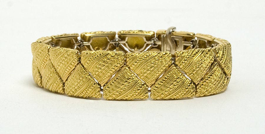 Eighteen karat gold bracelet with a diamond clasp by Alex Sepkus. This is from his series called Crinkled Silk. Measures 7