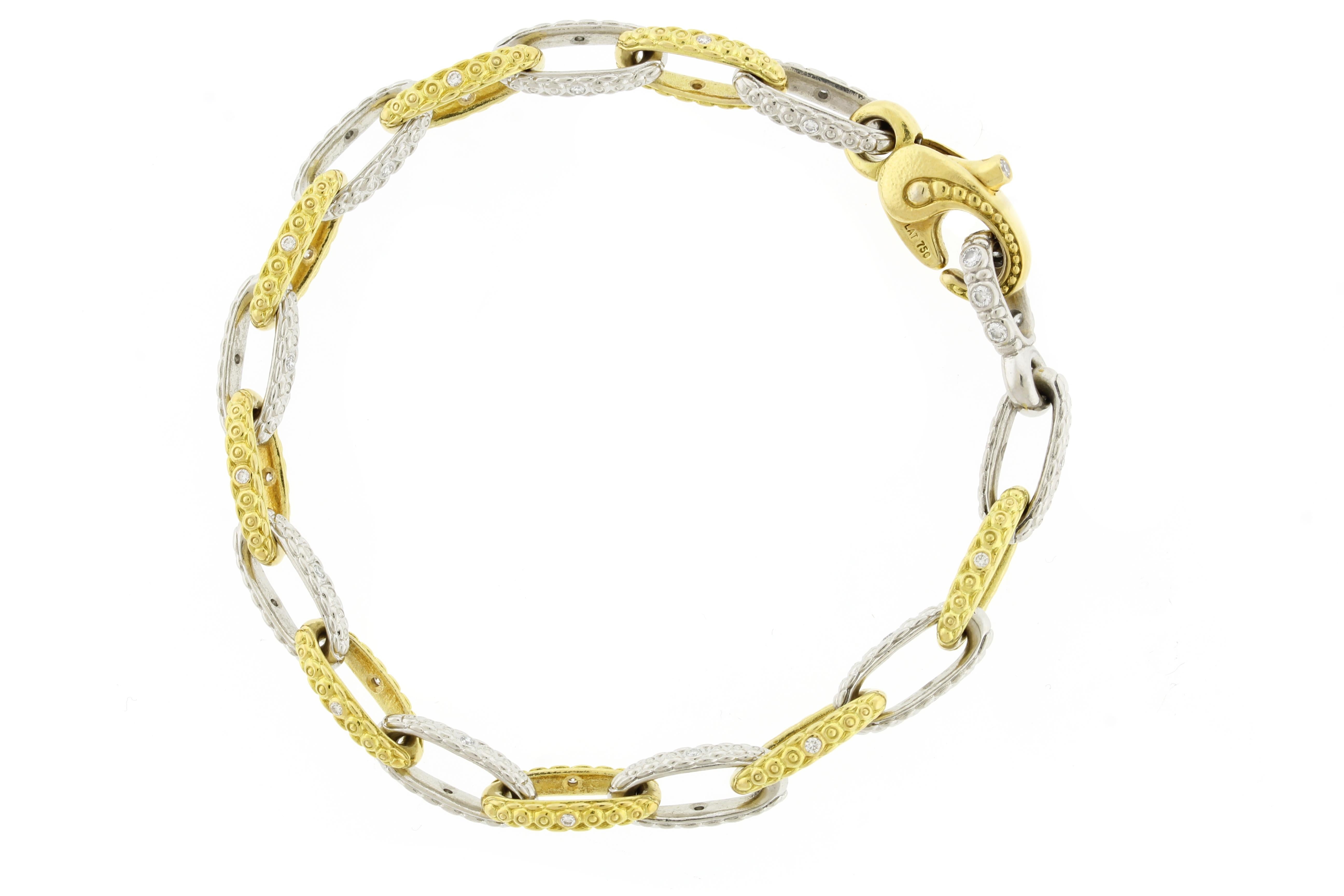  An alternating platinum and yellow gold scrolling textured chain bracelet with one diamond in each link.
• Designer: Alex Sepkus
• Metal: Platinum and 18kt yellow gold
• Circa: 2010
• Size: 7 ½
•Width: 6mm
•Weight: 28.2grams
• Diamond: 42 Diamonds=