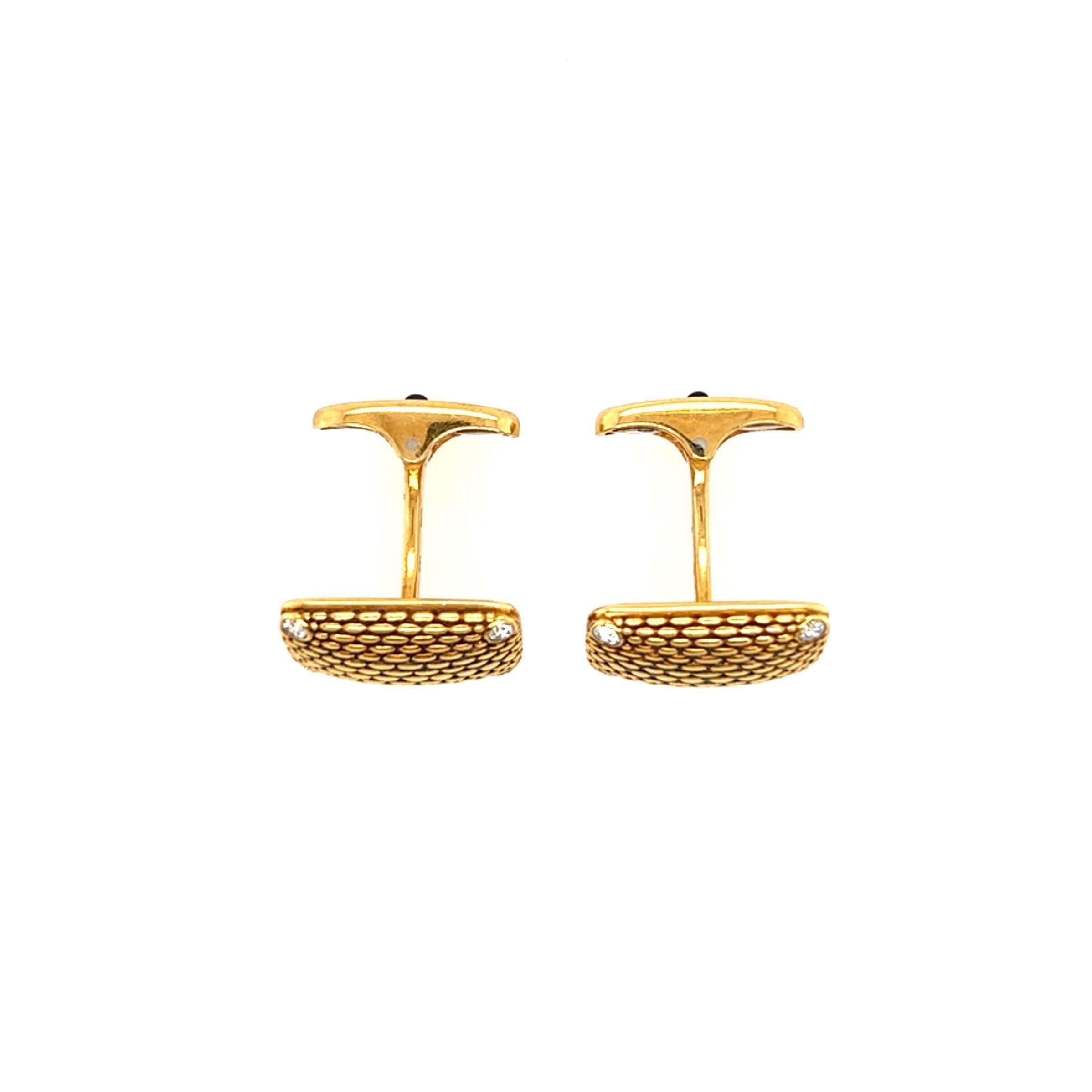 A pair of 18 karat yellow gold, diamond and sapphire cufflinks, Alex Sepkus.  The “Brick Work” cufflinks formed of textured rectangles with a brilliant cut diamond at each corner, each whale back centering a round cabochon sapphire measuring