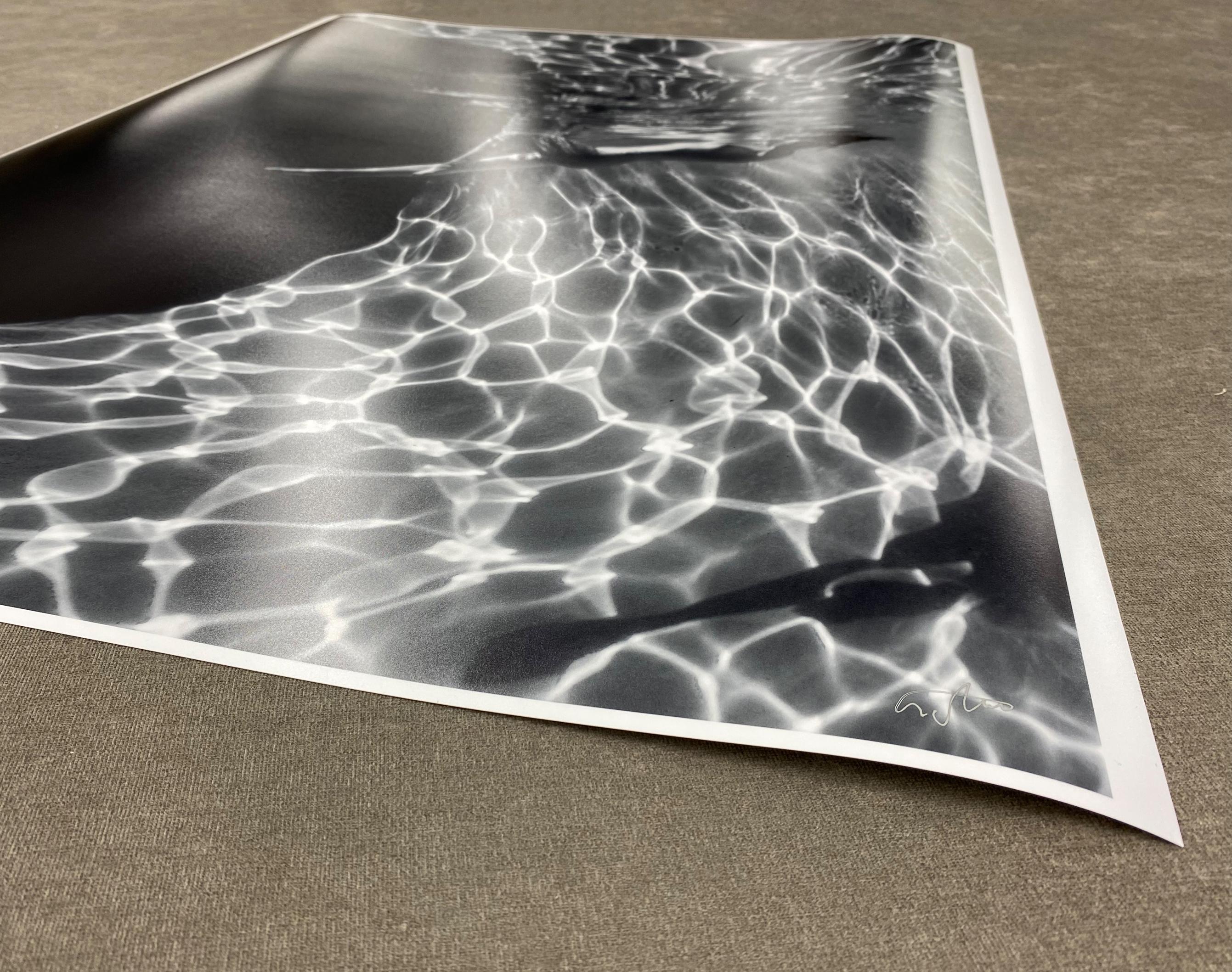 A beautiful  and mysterious underwater black and white photograph of a young naked woman relaxing on her back in her pool.  
This photograph is a part of the series Marble Cave

Original gallery quality archival pigment print.  
Limited edition of