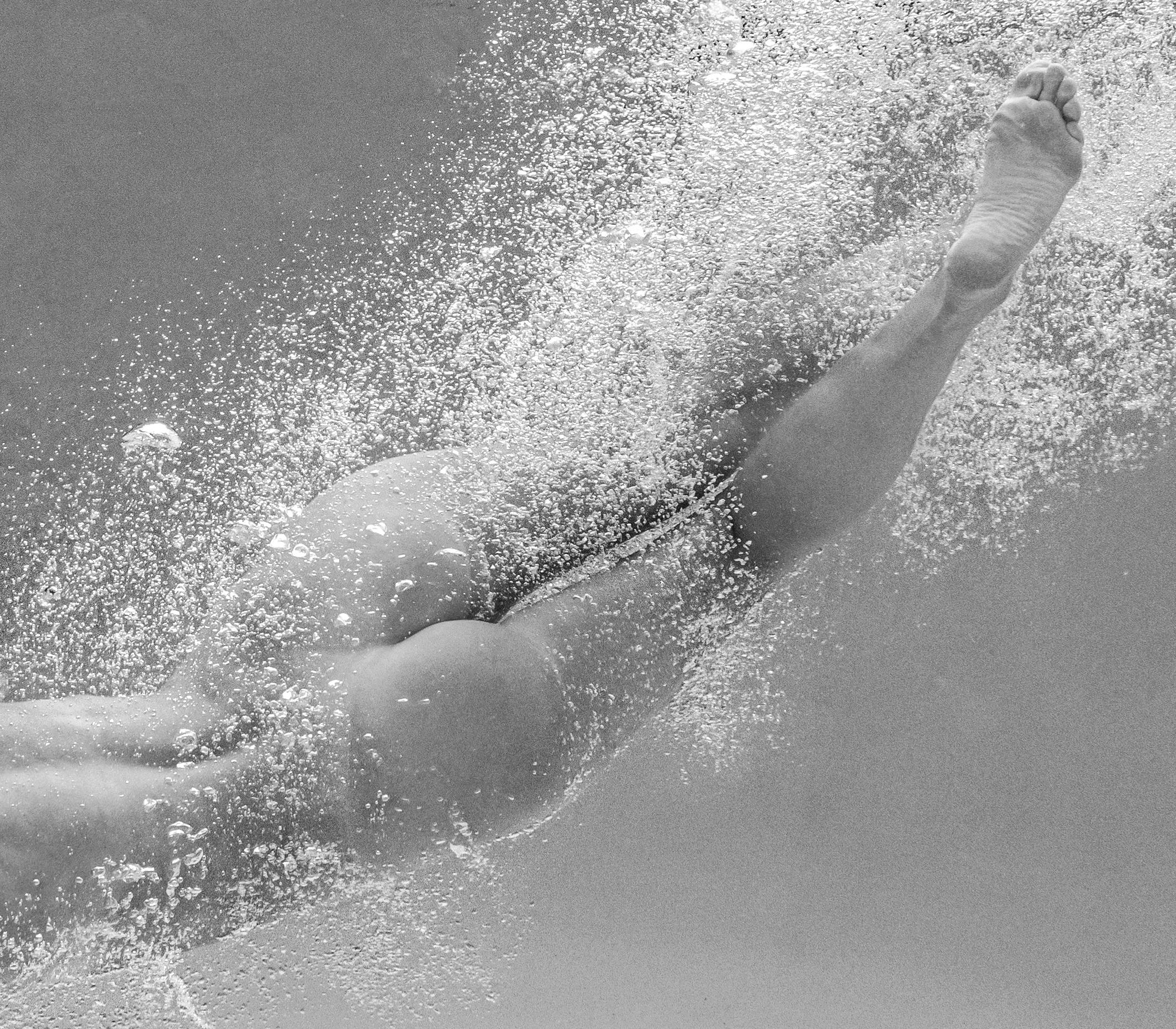 An underwater black and white photograph of a young naked woman in a pool.  

Original gallery quality archival pigment print  signed by the author. 
Limited edition of 24
Paper size: 18 x 24