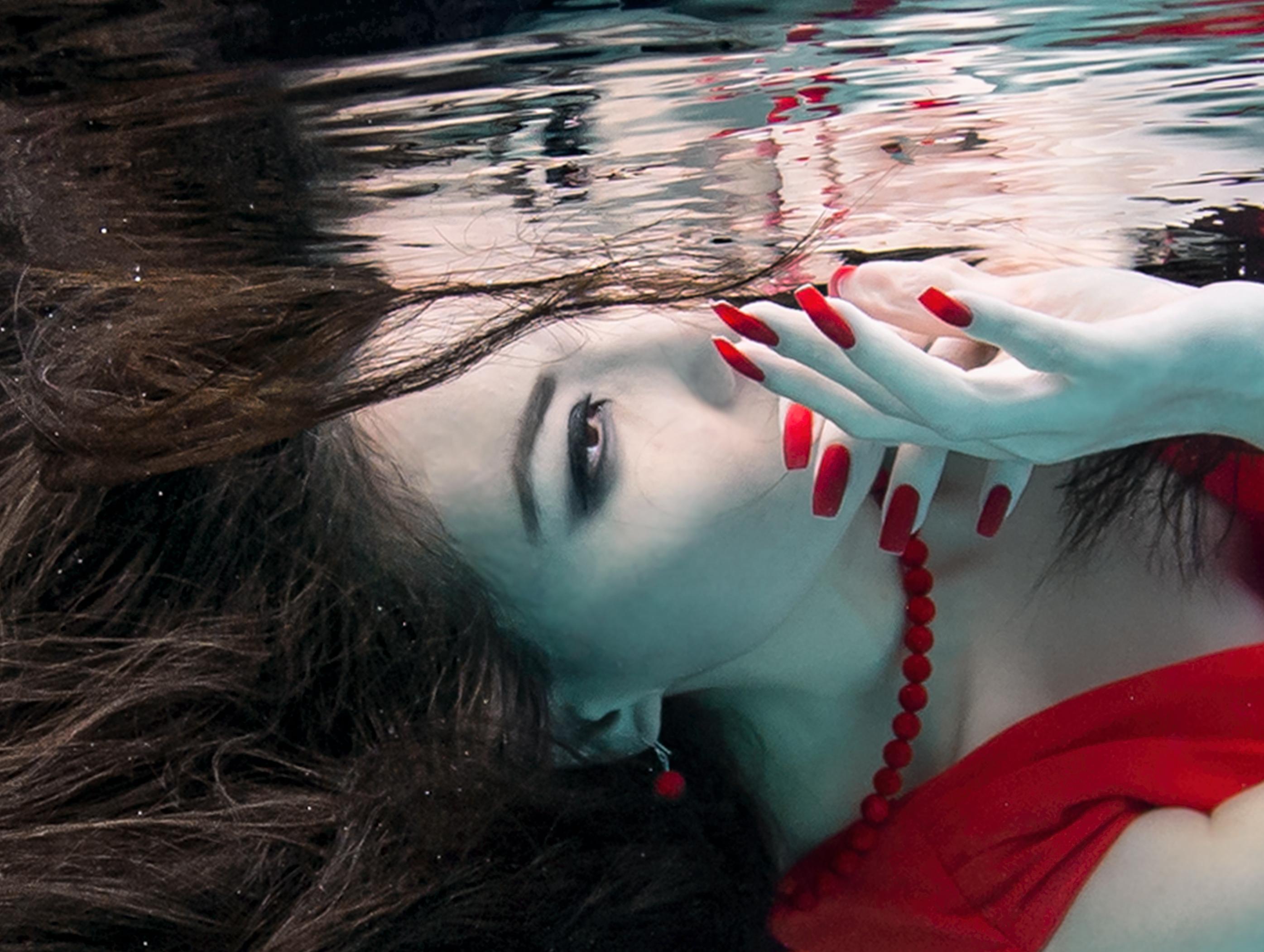 Underwater photograph of a gorgeous girl with dark hair in red dress.

Original gallery quality print on archival metallic paper signed by the artist.
Paper size: 36
