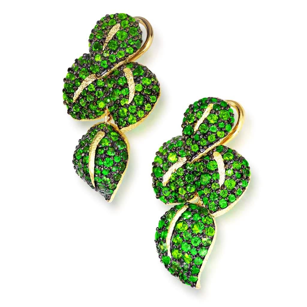 Alex Soldier Sunflower Green Leaf Earrings are a stunning work of art made in 18 karat yellow gold with tsavorites (green garnets) and Siberian chrome diopside, also known as Siberian emerald. These lovely earrings feature 8 gold leafs, each