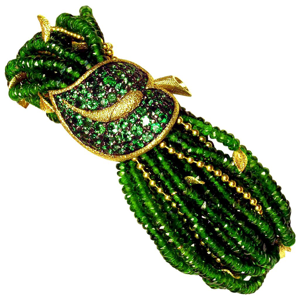 Alex Soldier Green Leaf Bracelet is a stunning work of art made in 18 karat yellow gold with 5 carats of tsavorites (green garnets) and 350 carats of Siberian chrome diopside beads, also known as Siberian emerald. The bracelet features Alex Soldier