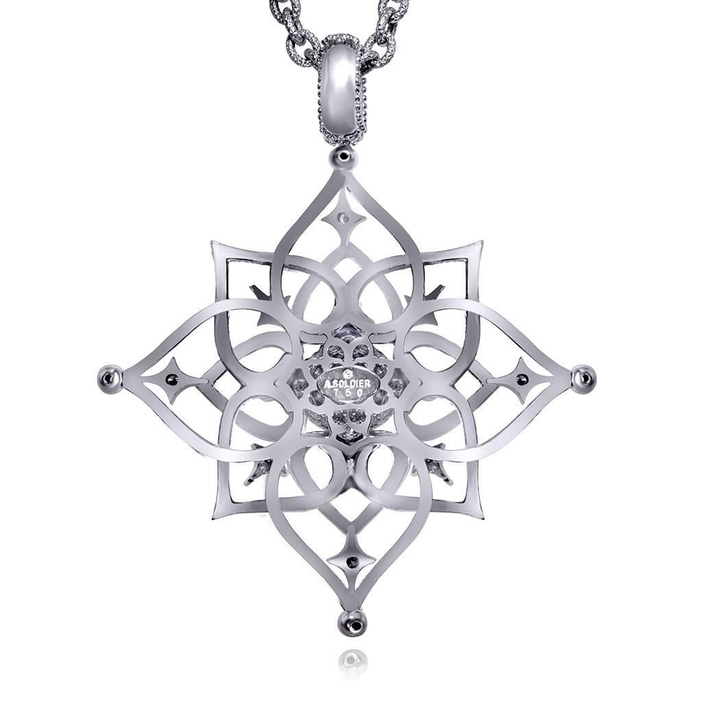 Alex Soldier's Magic Diamond Star pendant is made in 18 karat white gold with 1.5 carats of white diamonds and features a contrast surface of textured metalwork. This magnificent pendant enhancer can be worn on a chain, with a strand of pearls or