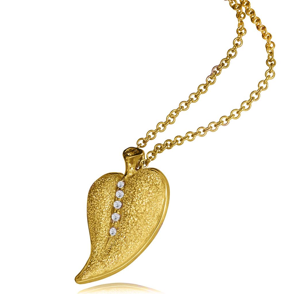 The Leaf is a symbol of nature and showcases an intricate metalwork, as if covered with the first drops of the spring's morning dew. Handcrafted with love in New York City from responsibly sourced materials. One of a kind. The pendant includes