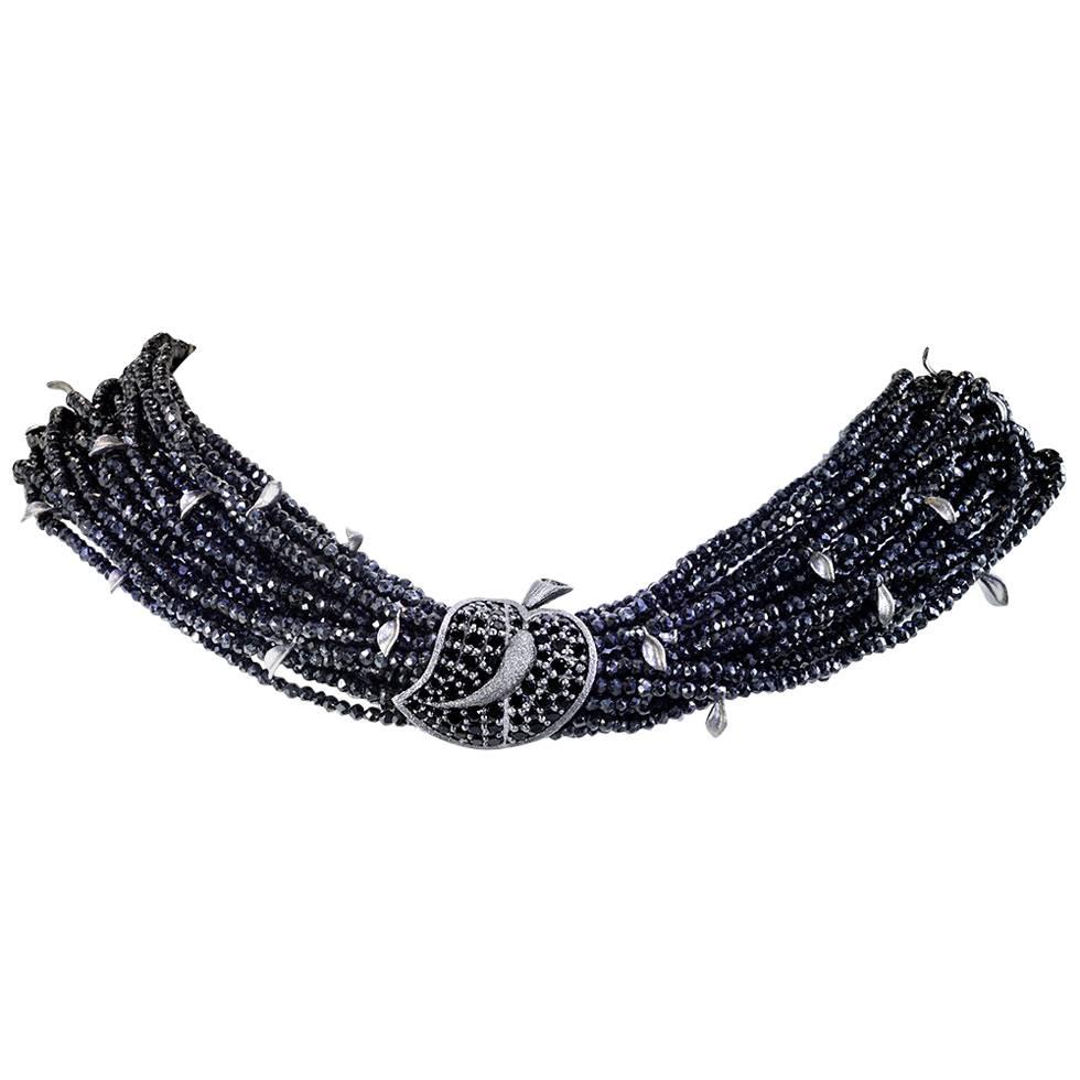 Alex Soldier Black Leaf Bracelet is a stunning work of art made in blackened sterling silver with 208 carats of black spinel. The bracelet features Alex Soldier invisible clasp invention and holds 30 gold leafs, each individually hand textured under