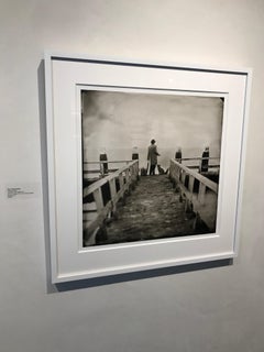 Fleeing Brexit- white framed black and white photograph