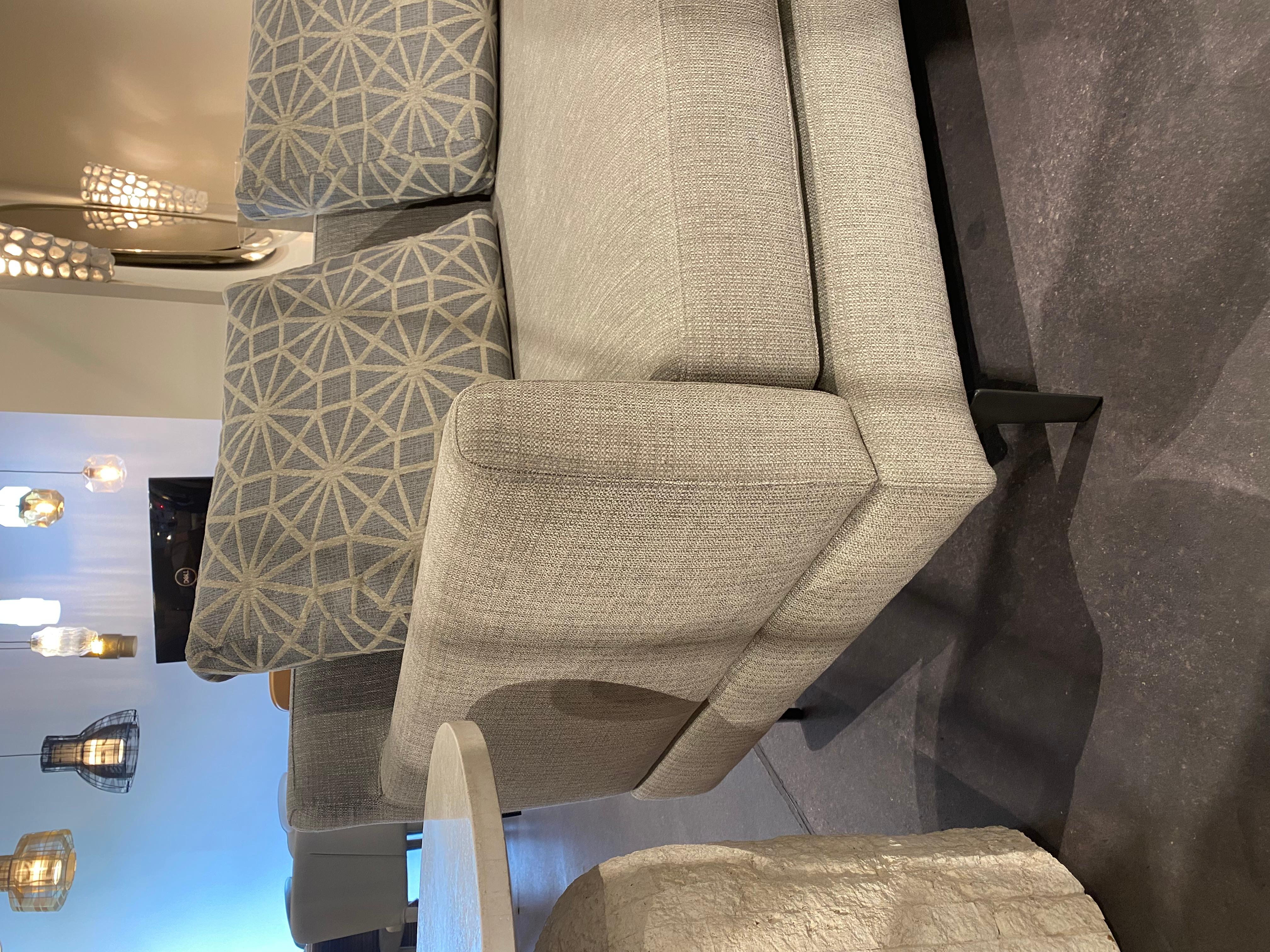 Beautiful quality upholstery by Della Robbia.  Made in California, very contemporary and comfortable.  Three pieces with hidden latch attachment under the frame.  Measures 175 across by 70 deep.  Seat height 17 back height 33.  This is a floor model