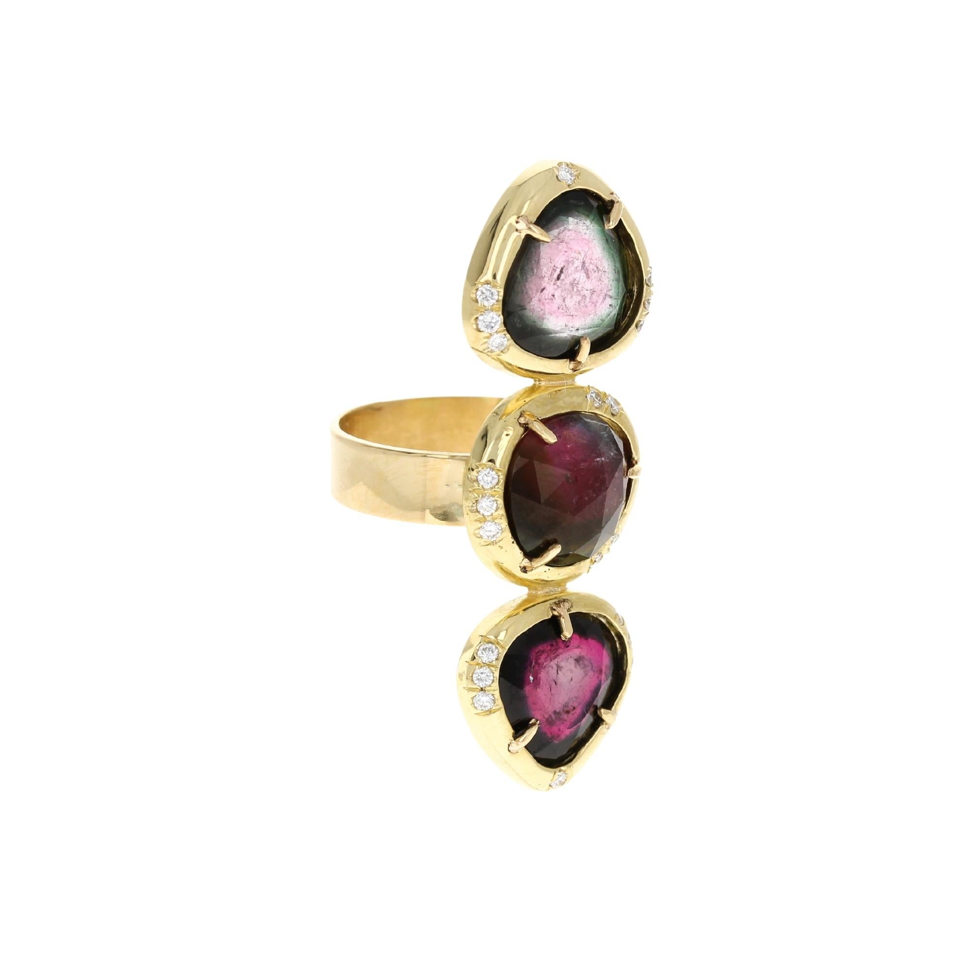 The Alexa Ring is a one of a kind & handcrafted in 18kt yellow gold with three sparkling natural bicolor tourmalines and 0.19ct TW pavé diamonds.