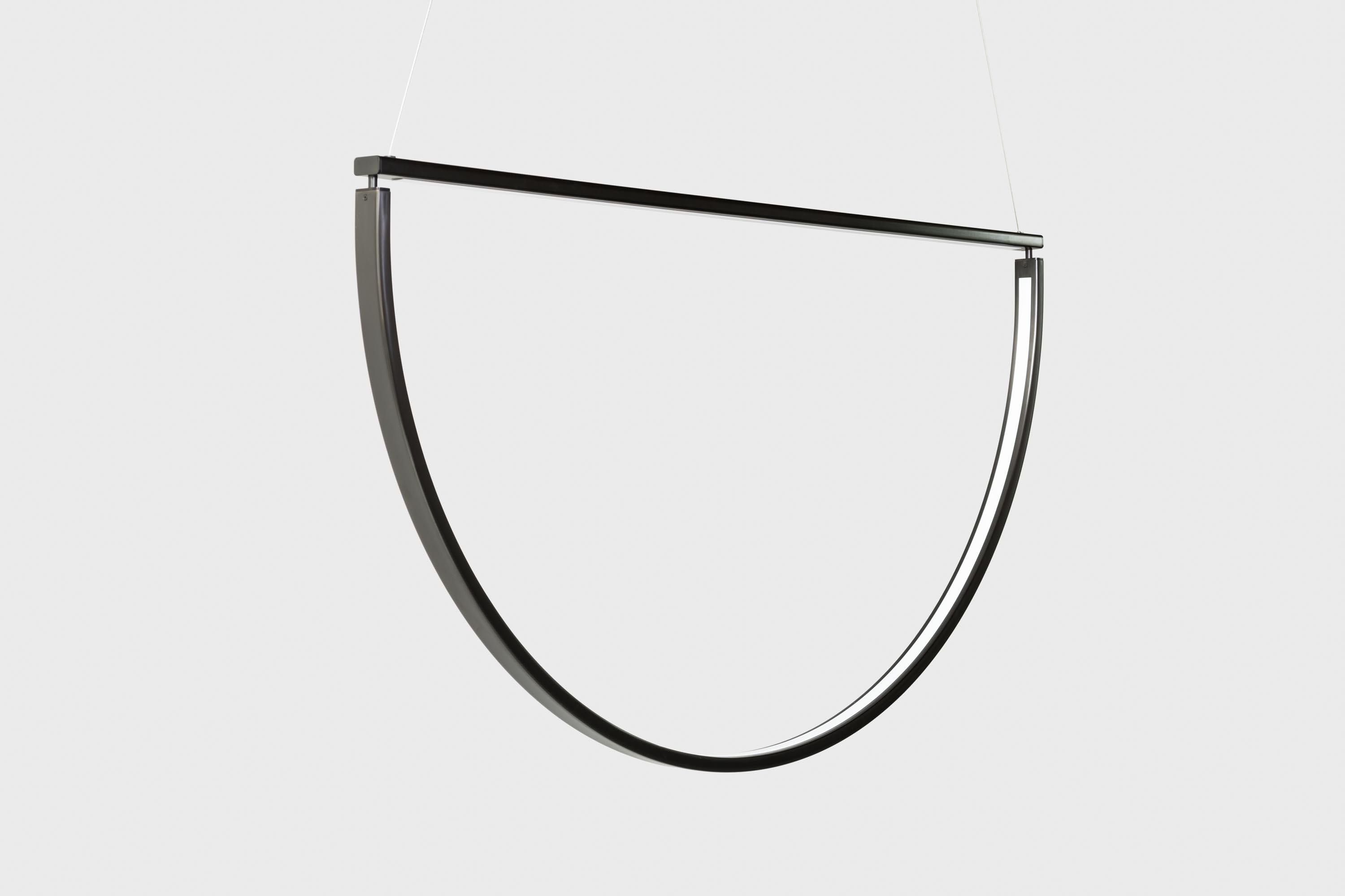 Chord draws inspiration from minimalist jewelry, and its metal finishes and details exude the same refinery and elegance. Light emanates into a void, its source hidden in the simple form of a delineated semi circle; the atmospheric effect of the