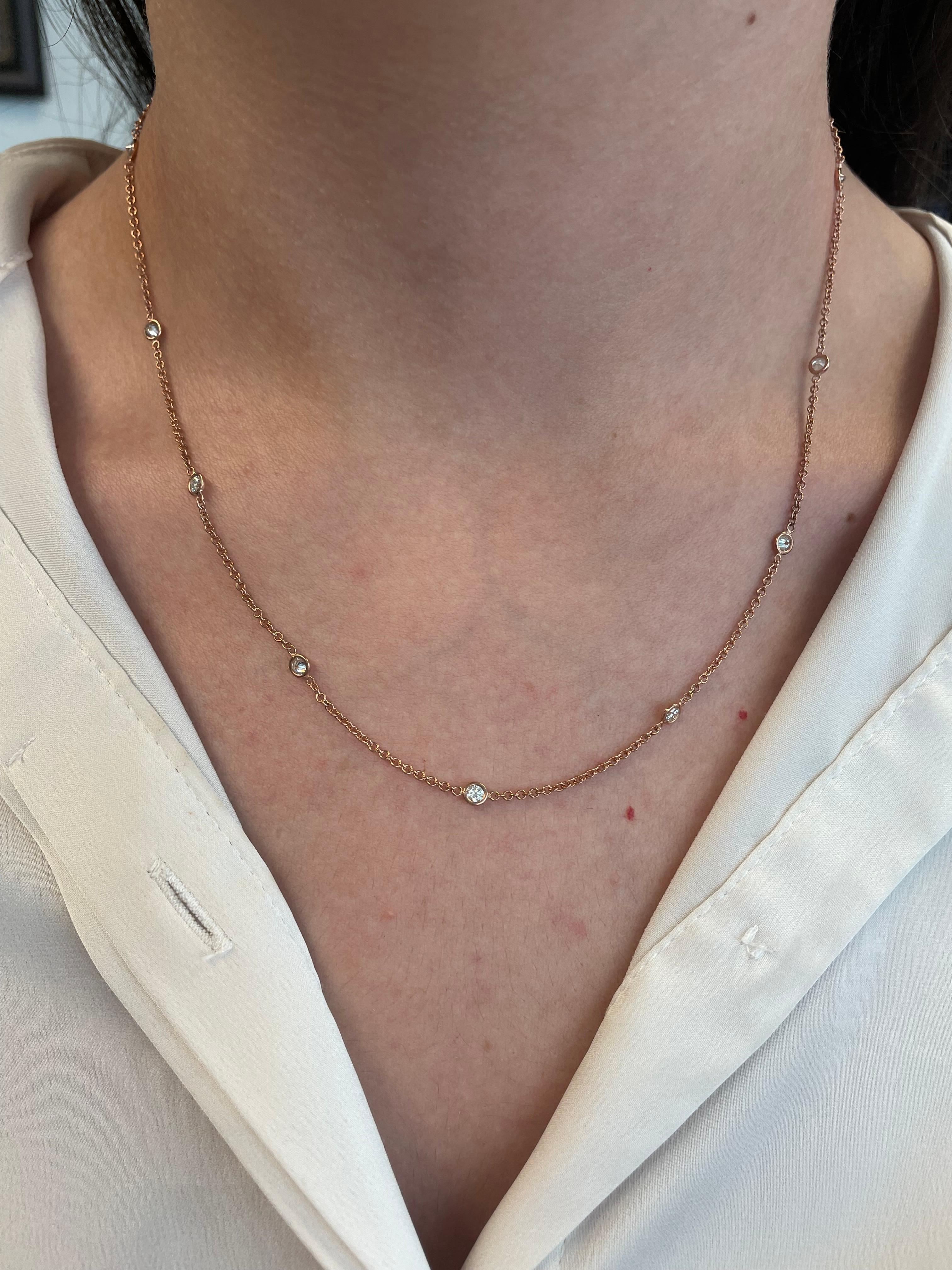 Exquisite round brilliant diamonds by the yard modern necklace. By Alexander Beverly Hills.
12 round brilliant diamonds, 0.93 carats total. Approximately G/H color and SI clarity. Bezel set in 18k rose gold, 3.60 grams. 
Accommodated with an