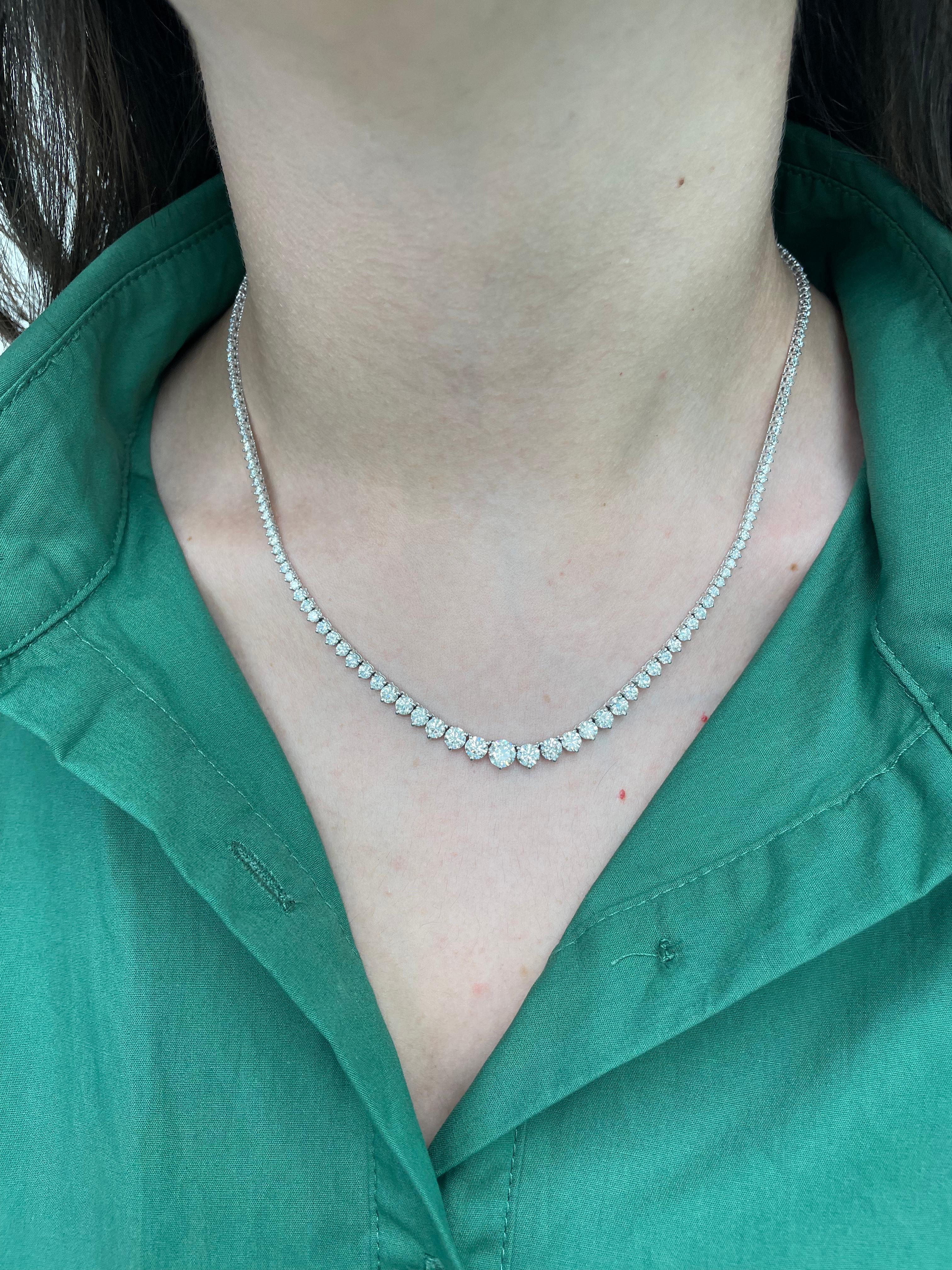 Beautiful and classic diamond tennis riviera necklace, by Alexander Beverly Hills.
10.01 carats of round brilliant diamonds (including center 0.70ct), approximately F/G color and VS2/SI1 clarity. 14k white gold, 14.94 grams, three prong set,